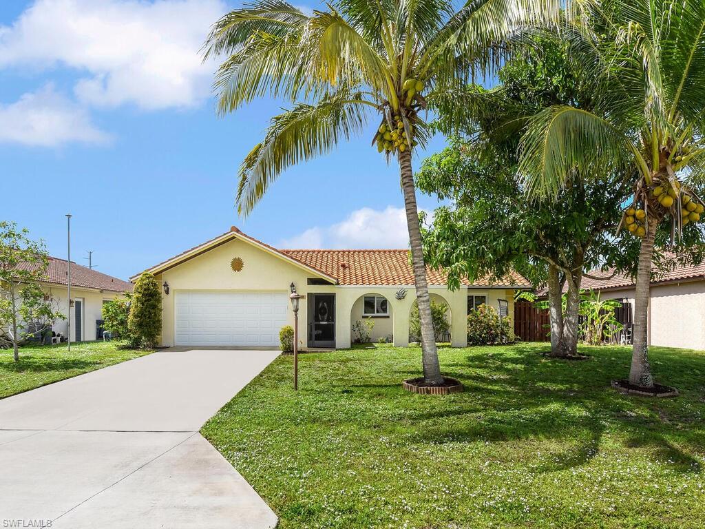 Single family pool home NOT IN A HIGH RISK FLOOD ZONE (Zone X) & NO HOA! Meticulously cared for and updated w/ all newer appliances & kitchen sink, NEW hot water heater(2025), custom murals on privacy walls, & whole home Culligan water filter system & softener. You will love the open floor plan of the home w/ cathedral ceiling, tile flooring throughout, large closet systems, long screened front entry, courtyard area in front of home, split bedroom & great room design, spacious kitchen w/ breakfast nook area & pantry, attached 2-car garage w/ full size fridge & laundry area, huge screened rear lanai w/ pool & covered sitting area, and a fenced in backyard w/ storage shed & fruit trees (banana, mango, lemon, avocado, coconut). For storm protection the home offers impact resistant windows w/ exception of sliders to lanai, there are manual shutters for those. Situated in a well-established non-gated neighborhood in the heart of Bonita Springs that is known for its close proximity to the beach, easy access to I-75, and is just a short bike ride or drive to the Bonita Springs River Park/Downtown area where you can find activities for the entire family!