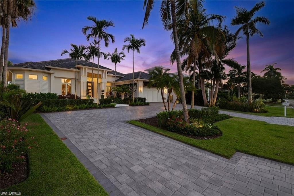 Move in ready !!! Welcome to 1955 Tarpon Road in prime Royal Harbor location. This thoughtfully redesigned and renovated canal front home boasts 4 Bedrooms and 3.5 Bathrooms in 3000 square feet of truly exceptional casually elegant Naples living. No expense spared in this total custom renovation with meticulous attention to detail with only the highest quality materials and craftsmanship. This house is at 10.66’ elevation and took in no water in the house or garage during Ian and the property is insured as a new construction house.
Enter into a welcoming foyer to a fabulous open-concept living space with soaring ceilings and heavenly expansive views of the outdoor living space. Gorgeous living room with 10" light oak wide plank hardwood floors imported from France, coffered ceiling, linear fireplace and custom contemporary wood accents with wall of glass opening out to outdoor oasis with saltwater pool and spa, multiple lounging and entertaining areas, new seawall, new dock and new 16k pound boat lift. A true chef's eat-in kitchen replete with oversized island perfect for daily dining and entertaining. Custom cabinetry, Thermador 6-burner range with hood and Gaggenau double refrigerator and freezers. Lovely sitting area overlooking the water plus dining room. Master suite oasis features a spacious bedroom with custom beamed ceiling overlooking the water, walk-in closet with custom built-ins, and a spa-like bath with oversized walk-in shower, freestanding soaking tub, double vanity and separate water closet. 2 additional guest suites plus a 4th bedroom with new leaded contemporary glass doors is perfect for den, home office or additional guest quarters plus a powder room and convenient laundry room.  2-car attached garage with epoxy floor plus gorgeous new landscaping and dramatic outdoor lighting. A boater's dream with quick access to Naples Bay and the Gulf. Walk, bike or golf cart ride to downtown Naples renowned worldwide for its fine, dining, shopping and beaches. Easy access to Naples and Fort Myers airports. Truly exceptional Naples living at its finest.