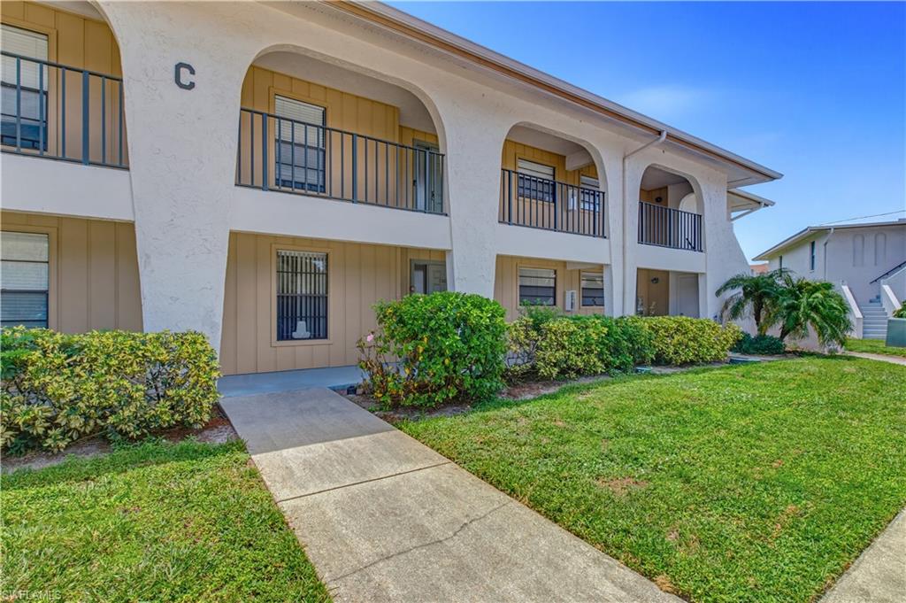 Lakefront living feels effortless in this inviting two-bedroom, two-bathroom Naples condo, where a spacious floor plan and calming water views create an ideal everyday retreat.  Neutral decor and tile flooring throughout provide a clean, cohesive backdrop ready for your personal style. The well-planned interior offers comfortable room for relaxing, dining, and entertaining, while an in-residence laundry area keeps household routines simple. Recent improvements add valuable peace of mind, including a complete plumbing re-pipe and a new metal roof completed in 2023. The renovated primary bathroom features a walk-in shower, updated cabinetry, and a new countertop. The guest bathroom also feels fresh with its new vanity and countertop.  The updated kitchen features new cabinetry, stainless steel appliances and ample storage.  Outside, the large screened lanai will  become your favorite space due to the calming lake views. Settle in with coffee and watch the lake come to life, or unwind at sunset as the water provides a peaceful backdrop. Easy access to the community pool makes a quick swim or leisurely afternoon in the sun wonderfully convenient.  The location rounds out the appeal with shopping and groceries nearby, including Seed to Table and Publix. Outdoor recreation awaits at Cocohatchee Creek Preserve and North Collier Regional Park. Interstate 75 is readily accessible, and Vanderbilt Beach is approximately ten minutes away, making spontaneous beach outings easy to arrange.  This property is an  excellent opportunity for a full time residence, a seasonal retreat, or a wonderful investment property.
