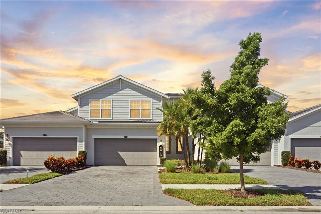 A new price, fresh paint, and new laminate wood flooring set this 2022 Bay Creek coach home apart at The National Golf & Country Club at Ave Maria. Wake up to lake and golf course views, with a deeded bundled golf membership included in your purchase.

The split-bedroom floor plan offers 3 bedrooms, 2 baths, and 2,110 square feet of living area with volume ceilings, crown molding, and ceiling fans throughout. Freshly painted walls and new flooring give every room a bright, clean, move-in ready finish. The kitchen opens to the great room and features a large island, walk-in pantry, breakfast bar, and full appliance package. The primary suite includes dual sinks and a walk-in shower.

Step out to the screened lanai to enjoy peaceful lake and fairway views. A rare 3-car attached garage gives you room for vehicles, a golf cart, and storage.

Built in 2022 with concrete block construction, a tile roof, impact-resistant windows and doors, and fire sprinklers.

Your bundled golf membership includes the championship course, resort-style pool with bar and grill, attended fitness center, lap pool, tennis, pickleball, bocce, and sauna, all inside a gated community. Ave Maria offers Publix, dining, parks, and town events, with easy access to Big Corkscrew Island Regional Park, Great Wolf Lodge, Oil Well Road, Immokalee Road, and Naples beaches.

Schedule your private tour and see this refreshed home in person.