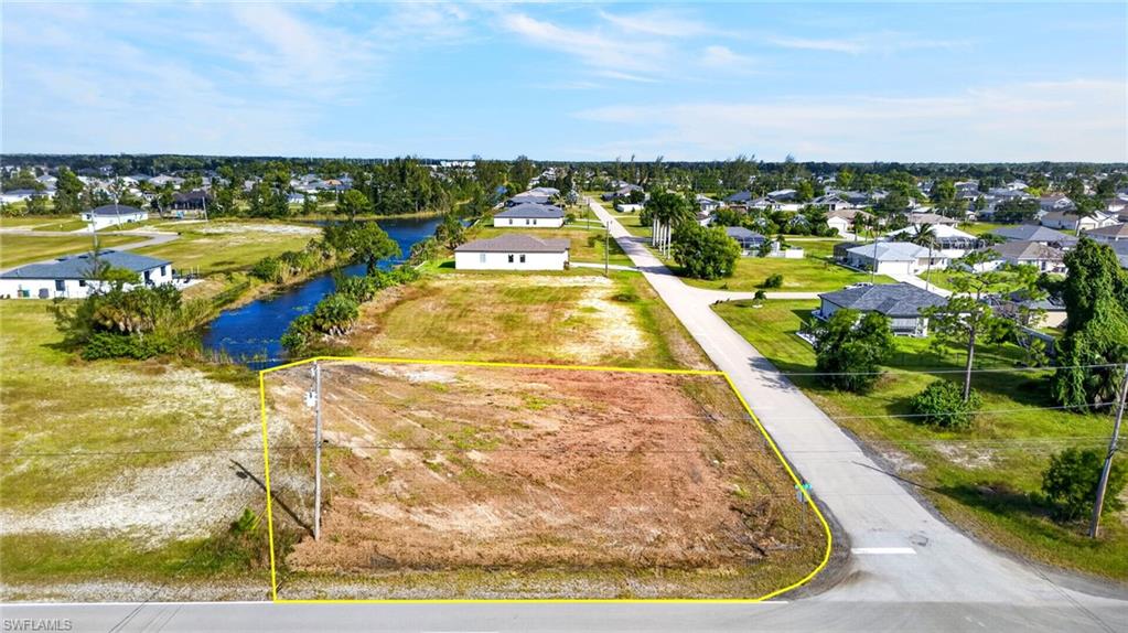 **ONLY $30,000 FOR AN OVERSIZED 0.33-ACRE FRESHWATER CANAL LOT IN CAPE CORAL!** Located in the growing Gator Circle area of Northeast Cape Coral, this residential parcel has just undergone extensive professional site preparation, including mowing the entire property and clearing substantial overgrowth along the freshwater canal, dramatically improving its appearance and showcasing the waterfront setting. Offering approximately one-third of an acre, the property features eastern rear exposure for beautiful Southwest Florida sunrises over the water. Positioned north of the Pine Island Road corridor with convenient access to Del Prado Boulevard, this location places you within reach of shopping, dining, schools, everyday conveniences, and major routes connecting Cape Coral to Fort Myers. Nearby schools include Island Coast High School, Diplomat Middle School, and Diplomat Elementary School. The revitalized Downtown Fort Myers River District is also within a convenient drive, offering waterfront dining, entertainment, and local attractions. Adding to the area's appeal is the planned $700 MILLION CAPE CORAL GROVE, a 131-acre mixed-use town center along Pine Island Road featuring proposed retail, restaurants, entertainment, residential development, and walkable public spaces. Surrounded by an area experiencing continued residential construction and commercial investment, this oversized freshwater canal property offers an opportunity to secure land in Northeast Cape Coral at an attractive $30,000 price point. **An affordable opportunity to own an oversized canal-front parcel in one of Southwest Florida's growing residential markets!** Buyer to verify permitted uses, buildability, setbacks, and development requirements with the City of Cape Coral.