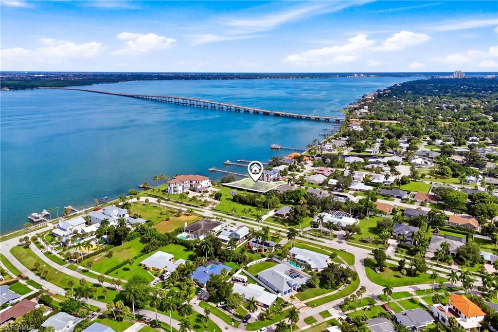 DIRECT CALOOSAHATCHEE RIVERFRONT in Fort Myers. Expansive water views and an established Casa Del Rio setting provide an exceptional backdrop for your vision of waterfront living. This vacant parcel offers the opportunity to explore a custom residence designed around the river, with gathering spaces that bring the views into everyday life. Imagine morning coffee overlooking the water and evenings spent watching the changing colors of the sky. Bring your builder and discover the possibilities at 8441 Casa Del Rio Lane. Buyer to verify building requirements, setbacks, utilities, and permitting for intended improvements.