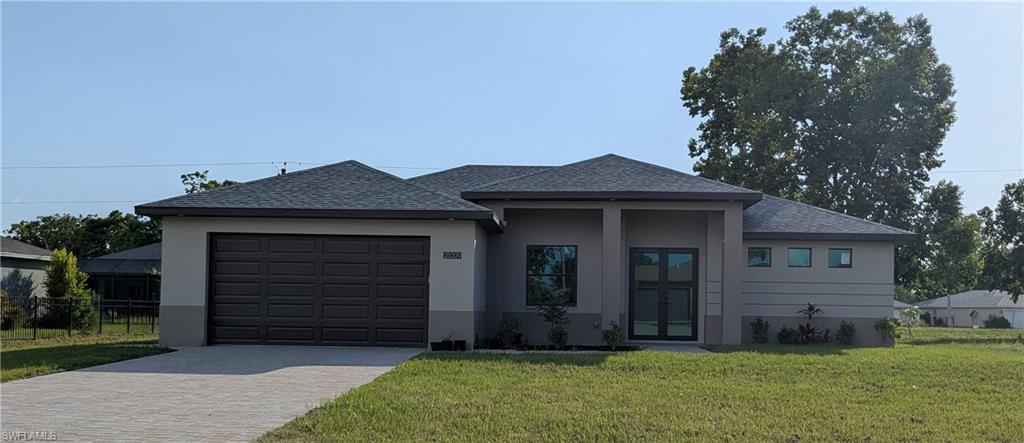 Move in ready! Beautiful new custom upgraded open floor plan with 9'4" ceilings and 10' tray ceilings. This lovely home is loaded with many extras such as IKO shingles, ECO impact low E insulated windows and doors, shaker style cabinets with soft close doors, Quartz countertops in kitchen and bathrooms, stainless steel Samsung appliance package, 8' solid Madison doors, ceiling fans and tile throughout, wide baseboards, electric water heater, washer & dryer, smart garage opener, epoxy coated garage floor, fenced backyard, city water and sewer, complete irrigation system and outdoor kitchen plumbing hook up. The home is just minutes away from I-75, 41, PG Airport, Burnt Store Marina, scenic and historic downtown PG, and fisherman's village. You will be minutes away from enjoying waterfront parks, walking and biking paths, weekend Farmers Market, events and more! This is a fabulous home in the great Burnt Store Village Community.