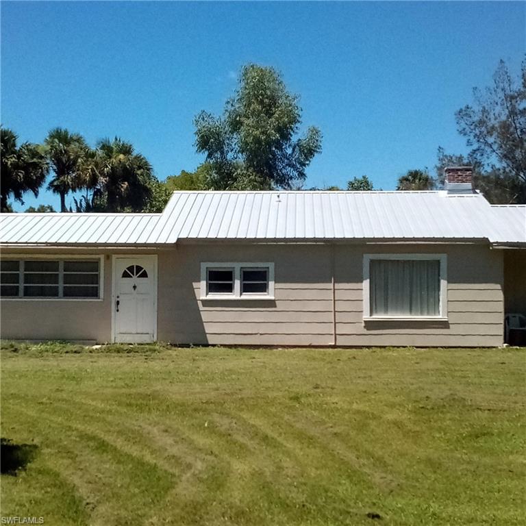 MAGNIFICENT DIRECT RIVERFRONT 1.75 acre, half city block property with MAJESTIC OAKS in the heart of Labelle! Just 3 blocks from Barron Park. Walk to eat or shop.

This property abuts the beautiful, quiet natural Caloosahatchee River waters!  This River Oxbow connects to the C-43 in a few hundred feet- giving your boat access to the Atlantic or Gulf. Fish from shore. See manatees. Showy peacocks reside and beg handouts. Zero flood risk!

Build an impressive Riverfront Estate, riverfront condos, or subdivide? Representative estates are further west along Ft. Thompson Rd.  This corner lot’s roads were paved in the last few years when new water and sewer mains were installed, with two full services already in place. Nearby fire hydrants. A sidewalk is scheduled. 

An older, solidly constructed frame-on-slab home with recent metal roof exists and is partially renovated with modern water piping and ample electric circuits. A full RV connection is behind. Complete the renovations, rent it, or convert to an estate carriage house?