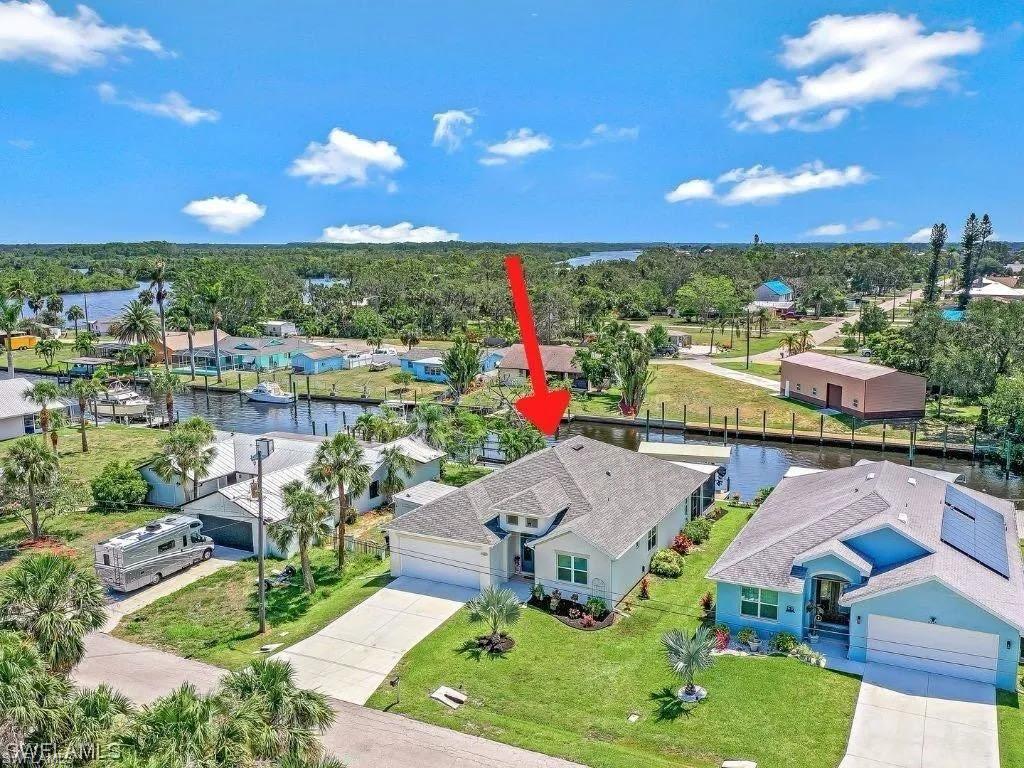 Modern Waterfront Living in Isle of Pines – Built 2019 | Impact Glass | Boat Lift | Gulf Access Welcome to 2214 Isle of Pines—where newer construction meets true Southwest Florida waterfront lifestyle. Built in 2019, this elevated canal-front home offers the peace of mind, efficiency, and storm resilience that buyers are actively searching for—without the compromises of older homes in the area. No HOA and low-traffic dead-end street. This home is designed for both comfort and confidence: Impact-resistant windows and doors for safety, insurance savings and energy efficiency. High and dry during Hurricane Ian - a major advantage in this market. Newer construction means lower maintenance and higher long term value. Enjoy your private waterfront oasis with a composite dock and 10,000 lb boat lift, offering quick access to open water, including Caloosahatchee River and Gulf access for great fishing, water skiing,tubing and other water sports. The western rear exposure delivers stunning sunsets, making the screened lanai the perfect place to unwind at the end of the day. Unlike many surrounding properties, this home stands out as true modern construction - not a dated home with partial updates. It offers the rare combination of newer build quality, contemporary finishes and layout, storm ready features, fully equipped boating access. Located in the desirable Isle of Pines neighborhood, you're just minutes from downtown, dining and Gulf access while still enjoying quiet, residential waterfront setting. Step inside to an open-concept design featuring 10-foot ceilings, 8-foot doors, and a bright, airy layout that immediately feels like home. The spacious kitchen is the centerpiece, complete with a large island, walk-in pantry, new and upgraded washer/dryer, microwave and refrigerator, and seamless flow into the main living and dining areas—perfect for entertaining or everyday living. Tile flooring runs throughout the main spaces, adding durability and a clean, modern look. This home is designed for both comfort and confidence: FLOOD INSURANCE IS TRANSFERABLE. If you've been waiting for a move-in ready waterfront home that doesn't require renovation, this is it.