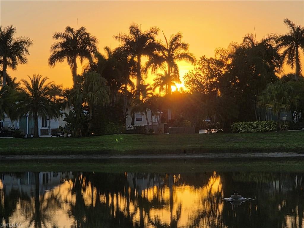 Lot 29 offers an exceptional blend of luxury, comfort, and lifestyle in a beautifully designed setting. Begin your mornings with a peaceful cup of coffee while taking in stunning sunrise views, setting the tone for another perfect day in paradise. This impressive 16x24 coach house embodies high-end elegance with a thoughtfully crafted interior and luxurious finishes throughout. Expansive sliding glass doors seamlessly connect the indoors with Florida’s lush natural beauty, creating a bright and inviting living space. Inside, you’ll find stainless steel appliances, granite countertops, and an elegant island with four bar stools that anchors the kitchen. The full bath includes an oversized vanity and a beautiful walk-in shower. The coach house is fully equipped with a washer and dryer, sleeper sofa, recliner, credenza, trash and recycle bureau, mini-split A/C, and television. A hidden storage loft adds both functionality and charm. Step outside to an expansive, beautifully furnished patio designed for both relaxation and entertaining. Enjoy a lever umbrella, a wooden dining table with six chairs, couch, fire pit, RV stairs, three storage units and a golf cart. Ideally located just a short walk from the Creations Clubhouse and the RC car racetrack, Lot 29 places you near unique and engaging activities. This golf-cart friendly community offers an unmatched lifestyle, including an Olympic-size pool, two hot tubs, shuffleboard, bocce, horseshoes, and a putting green. Spend afternoons at the poolside bar enjoying tropical drinks and meeting new friends or visit the Pool Clubhouse for fitness and social activities. There's always something going on at the River Clubhouse, from Mah Jongg and billiards to dancing, bingo, trivia, and bunco nights. And don’t miss the charming Saturday morning model train display — a nostalgic favorite as trains wind through miniature villages, bridges, and tunnels. Peaceful moments are just as easy to find. Relax by the gazebo or head out on the river thanks to easy boat dock access. Trailer and boat storage are available on-site, and the entire community is pet-friendly — making it perfect for those who want to bring their four-legged family members. Lot 29 is more than just a property, it’s a lifestyle filled with relaxation, recreation, and connection. Don’t miss the opportunity to make this exceptional retreat your own.