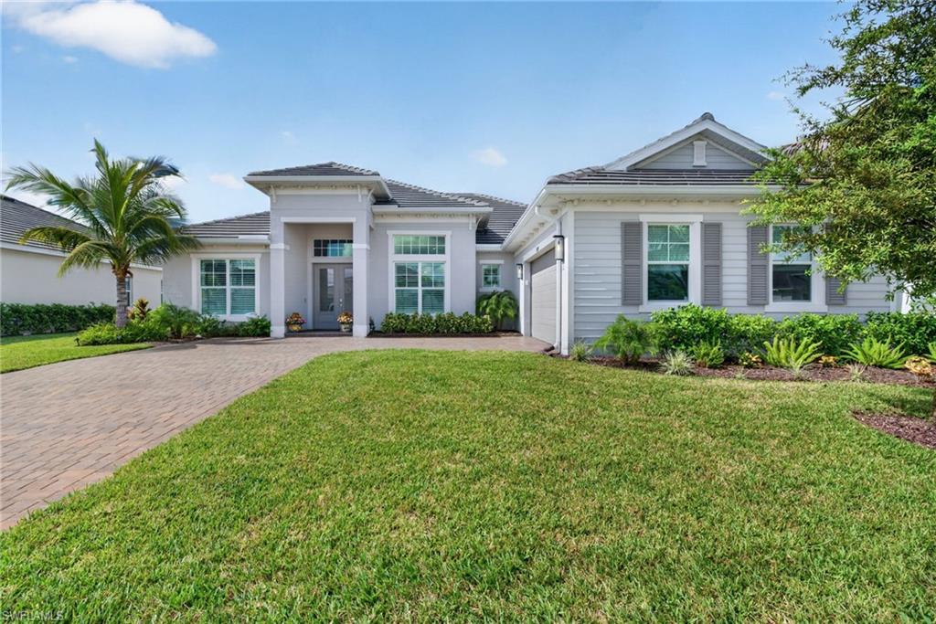 Stunning 4-bedroom, 3-bath home offering 2,811 square feet of coastal-inspired living in the sought-after Heritage Landing golf community. This open, light-filled residence features tray ceilings, oversized ceiling fans, and large-format tile throughout. Impact-resistant sliding glass doors open to pool and lake views, creating a seamless indoor-outdoor flow. The kitchen anchors the great room with a quartz waterfall island, white shaker cabinetry, stainless-steel appliances, pendant lighting, and a bright breakfast nook overlooking the pool and lake. A formal dining area with built-in butler’s pantry and plantation shutters adds refined elegance.
The primary suite boasts tray ceilings, lake views, and a dual-vanity bath complete with soaking tub, walk-in shower, and makeup vanity. Two guest bedrooms are located on the opposite side of the home; one offers convenient bath access to the lanai and pool area. The fourth bedroom features a coffered tray ceiling and glass French doors, ideal as a flexible living space.
Outdoors, enjoy a custom pool and spa surrounded by sealed covered pavers and a spacious covered seating area with picture-screen enclosure that frames beautiful lake views.
Discover the lifestyle that makes Heritage Landing a premier golf community destination.