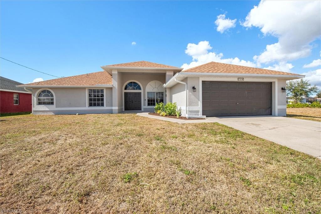 This single-family waterfront pool home boasts 3 bedrooms plus a den, 2 bathrooms, a 2-car garage. This empty canvas is waiting for you to create your own home. The spacious den/office provides the perfect space for working from home or turn it into a game/play room. Some features include stainless steel appliances and tile flooring throughout. The master bedroom has 2 walk-in closets, a separate shower, and a soaking tub for ultimate relaxation. The interior and exterior have been newly painted including the garage & pool deck (2026) giving the home a fresh and inviting feel. The whole pool cage was rescreened in 2026, ensuring a pristine outdoor space for years to come. With a new ROOF in 2023, AC in 2022, water heater in 2025, and brand new fridge and dishwasher in 2026, this home is move-in ready and worry-free. All the big ticket items are done for you! The split floor plan offers privacy and convenience, while the inside laundry room with a sink adds functionality to everyday tasks. Don't miss out on this incredible opportunity to own a truly exceptional waterfront pool home in a desirable location. No Flood zone which means no flood insurance! You can take your boat, jetskis or paddleboards to many nearby lakes including Shamrock Lakes, Lake Saratoga & Lake Kennedy. Live the life you've always dreamed of in this amazing property! Close to Fort Myers &  quick access to Pine Island Rd.