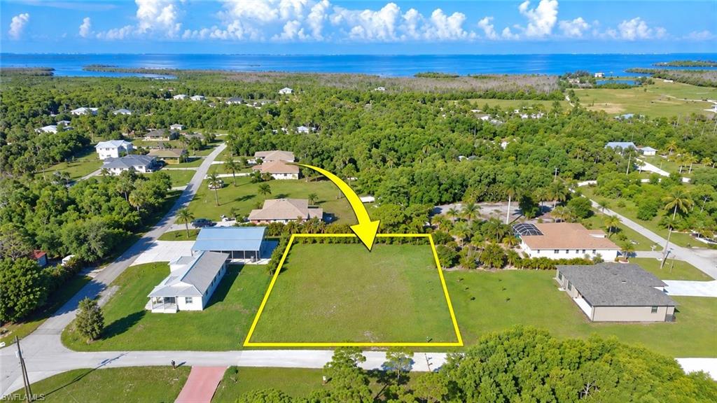 Build your island home on this CLEARED ½-acre lot in desirable St. James City on Pine Island! This homesite is ready for your plans, with water already brought to the property—an approximately $5,000 value and one less step for the new owner. Located in a growing yet peaceful neighborhood with no HOA, this property offers plenty of space while keeping you close to everything that makes Pine Island such a special place to call home. Enjoy world-class fishing and boating, nearby marinas, and popular restaurants. The seller is a local builder, providing buyers with the opportunity to purchase the lot and explore options for building their new home. Survey available. Come build your piece of paradise on Pine Island!