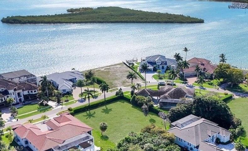 .5 acre lot in exclusive Estates area of Marco Island. cleared land with frontage on very private part of Caxambas Drive at the southeast tip of the Island. Surrounded by multimillion dollar homes and directly across from Barfield Bay/Caxambas pass. 
Nearby Publix and local businesses. Approximately 4 miles to beaches and public boat ramp.