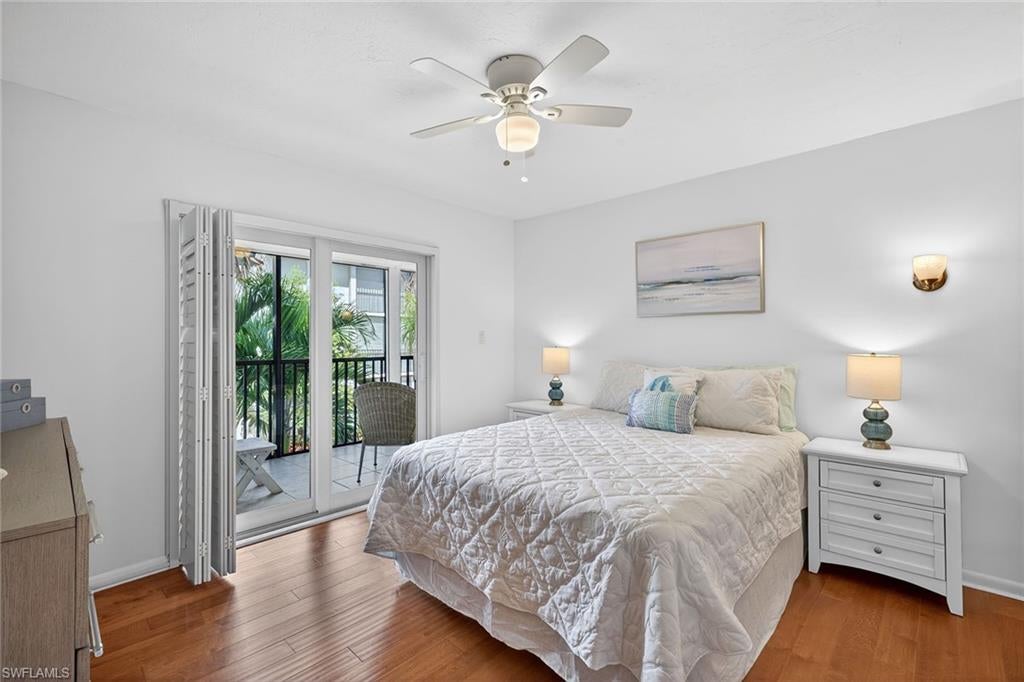 One or more photo(s) has been virtually staged, AI generated or rendered.  A sunny, west-facing second-floor corner residence in Hidden Lake Villas offers a rare opportunity in Park Shore. This partially furnished two-bedroom, two-bath condominium features an updated kitchen and baths, along with hardwood flooring and tile throughout. Relax on the white-tiled lanai with tranquil views of expansive, lushly landscaped grounds. A distinctive open-air courtyard with a fountain provides Capri building residents a unique outdoor living space. Set within a vibrant 16-acre community, Hidden Lake Villas features a natural lake, community pool, clubhouse, and recreational amenities including tennis and pickleball. West of U.S. 41. The community offers convenient access to Venetian Village, Waterside Shops and Fifth Avenue South for premier dining, shopping and entertainment. On-site management and full-time maintenance ensure a well-maintained, carefree environment. As a bonus, Park Shore Association membership is also available to Hidden Lake Villas residents to access the beautiful Park Shore beach, with parking and beachside facilities.