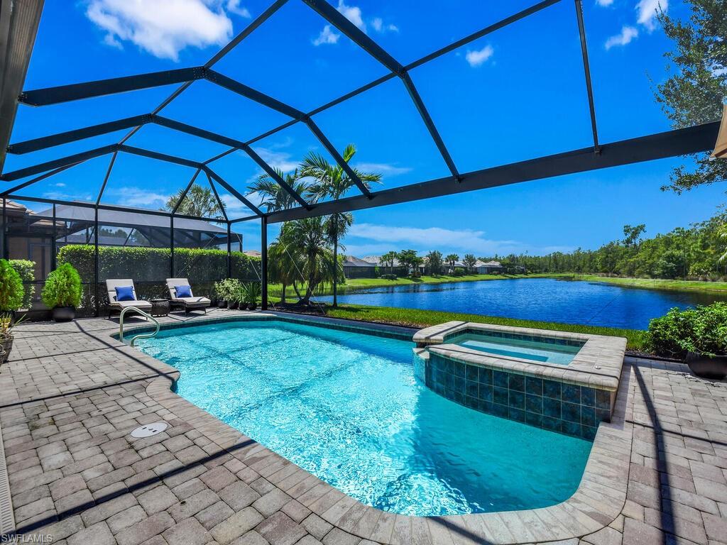 Motivated Seller! Luxurious Lakeside Living in Winding Cypress – Rare One Owner Pinnacle Model! 

Welcome to this stunning lake view home offering 3,656 sq. ft. of modern elegance in the prestigious, amenity-rich community of Winding Cypress. With 4 bedrooms, 4 bathrooms, a den, bonus room, and 2,5-car garage, this home is thoughtfully designed for both everyday living and entertaining on a grand scale.
Step inside to discover a light-filled open floor plan accented with tile flooring in the main living areas, brand-new luxury vinyl plank flooring in all three downstairs bedrooms, and crown molding throughout the first floor. The chef’s kitchen is a showstopper, boasting quartz countertops, premium KitchenAid stainless steel appliances, a new natural gas cooktop, soft-close cabinetry, walk-in pantry, new dishwasher, and upgraded sink—all designed for style and function.
Enjoy seamless indoor-outdoor living with zero-corner sliding doors that open to an expansive lanai featuring a picture screen enclosure, heated pool and spa, and a custom outdoor kitchen with built-in hub. With southwestern exposure overlooking the long lake and preserve, sunsets here are simply unforgettable.
Retreat to the primary suite with a spa-like bathroom and custom walk-in closets, while guests enjoy privacy with an en suite bedroom on the main level. Upstairs, the bonus room offers endless flexibility for a game room, theater, or additional living space.
This home is equipped with hurricane-impact windows, built-in Sonos surround sound system, smart home features, and abundant storage—ensuring comfort, safety, and convenience.
As a resident of Winding Cypress, you’ll enjoy world-class amenities, including:Heated resort-style & lap pools, hot tub, and gas fire pit, covered outdoor restaurant bar & grill, expansive clubhouse with fitness center, library, and event space, pickle ball, bocce, and tennis courts, miles of scenic sidewalks & boardwalk trails, two dog parks for furry family members.
Perfectly positioned on a premium lot, close to the community center and surrounded by excellent local infrastructure, this home is one of the rarely available larger homes in Winding Cypress—ideal for hosting family and friends in comfort and style.
Experience the best of modern Naples living in this extraordinary home.