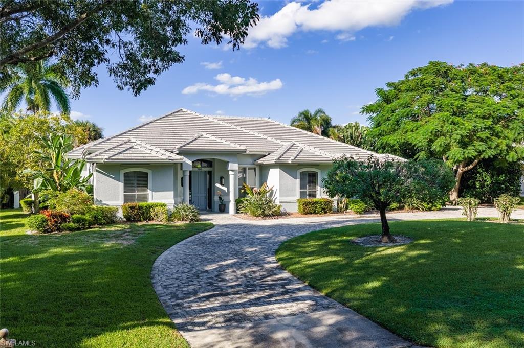 An extraordinary opportunity awaits in the heart of prestigious Coquina Sands, where an estate-sized homesite, exceptional outdoor amenities and an enviable location create endless possibilities for the discerning buyer. Offered at nearly land value, this remarkable property presents the rare flexibility to enjoy the existing residence, thoughtfully reimagine its interiors or create an entirely new custom estate in one of Naples' most desirable coastal neighborhoods. Particularly compelling is the property's impressive building potential, with a building footprint exceeding 8,000 square feet, providing an exceptional canvas for a magnificent new luxury residence. The existing home features a bright, generously proportioned open floor plan with four bedrooms, a versatile den easily accommodating a fifth bedroom, and an abundance of inviting spaces designed for both everyday comfort and entertaining. The true centerpiece of the property is its spectacular outdoor living environment, where an inviting pool and spa are complemented by a dedicated entertainment pavilion featuring a summer kitchen and outdoor living room. This impressive setting provides the perfect backdrop for elegant gatherings, relaxed afternoons and year-round enjoyment of Naples' exceptional climate. A new roof installed in 2024 adds significant value to the existing residence. Equally compelling is the property's premier location, just minutes from the sugar-sand beaches of Lowdermilk Park, The Moorings Golf and Country Club, the highly anticipated Naples Beach Club Four Seasons Resort, and the celebrated shopping, dining and entertainment of Fifth Avenue South. Whether envisioned as a sophisticated coastal retreat, a substantial renovation opportunity or the future site of a magnificent new luxury estate, this exceptional Coquina Sands offering combines immediate enjoyment with outstanding long-term potential in a highly coveted Naples setting.