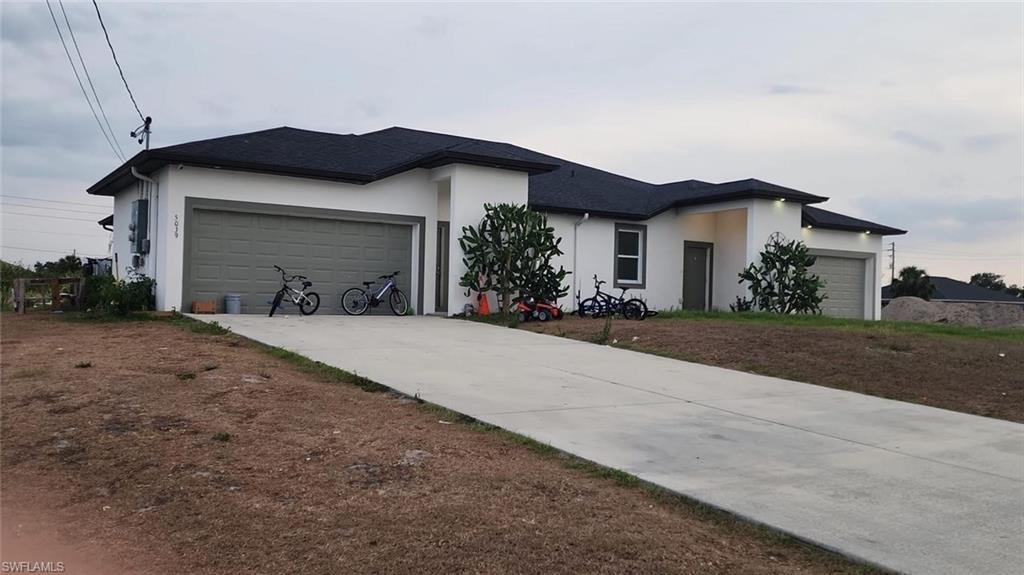 Welcome to this beautifully maintained duplex located in the rapidly growing community of Lehigh Acres. Whether you are an investor seeking reliable rental income or a homeowner looking to live in one unit while renting the other, this property is the perfect fit. Each side of this duplex offers a thoughtfully designed floor plan with a spacious layout, creating a comfortable and modern living experience. Both units feature a private two-car garage, an enclosed lanai, and an in-residence laundry room for ultimate convenience. The kitchens are a true highlight, equipped with stainless steel appliances, granite countertops, a breakfast bar, and modern pendant lighting that adds style and functionality. Ceiling fans throughout the home enhance comfort, while the open-concept design makes entertaining a breeze. The primary suites include walk-in closets, with one unit boasting a customized organizer system for maximum storage efficiency. Additional bedrooms are generously sized, making each unit ideal for families or tenants seeking extra space. Outside, the property is enhanced with a sprinkler system to maintain curb appeal year-round. Both units combine modern finishes with practical features, ensuring long-term tenant satisfaction and low-maintenance ownership. Location Highlights: Close to shopping, dining, schools, and parks - quick access to Fort Myers and I-75 - strong rental demand in this desirable and growing neighborhood. This duplex is more than just a property—it’s a smart investment with outstanding income potential. Whether you’re expanding your real estate portfolio or searching for a multi-family home with versatility. These units delivers the perfect combination of comfort, style, and value.