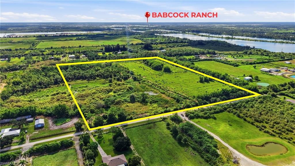 Discover 30.22 acres of agricultural land offering privacy, history, and opportunity in one of Punta Gorda’s most desirable growth corridors. Located directly on Rasmussen Road near Babcock Ranch and State Road 31, this AG 2 zoned property provides a rare opportunity to own substantial acreage while remaining convenient to Punta Gorda, Fort Myers, and surrounding Southwest Florida communities.

Originally developed as part of K&W Farm, the property has supported cattle, tropical fruit, beekeeping, and a variety of agricultural uses throughout its nearly 50 year history. The land was previously cleared and used as pasture and now features natural regrowth. Existing improvements include fencing and cross fencing, a well and pump house, diked areas designed to support drainage, and a flood control pump system used to help manage water levels during the rainy season. The seller reports that approximately $13,000 was invested in the pump system. A pond and additional natural water features contribute to the property’s rural character and wildlife appeal.

The property is currently used for beekeeping and maintains an agricultural classification. The beekeeper may be open to continuing the arrangement with a new owner, subject to confirmation and mutually acceptable terms. A recent survey is available. Electrical and other utility services appear to be available along Rasmussen Road due to surrounding residential development; however, utilities have not been installed on the property. Buyers should verify availability, connection requirements, and costs directly with the appropriate providers.

Whether your vision includes a private estate, working farm, equestrian property, recreational retreat, or long term land investment, this acreage offers room to create something truly special. Large acreage parcels in this growing area are increasingly difficult to find. Schedule your private tour and explore the possibilities of this remarkable property.

Buyer is responsible for verifying zoning, acreage, dimensions, access, utilities, wetlands, environmental conditions, agricultural classification eligibility, condition and operation of existing equipment, and suitability for the buyer’s intended use.