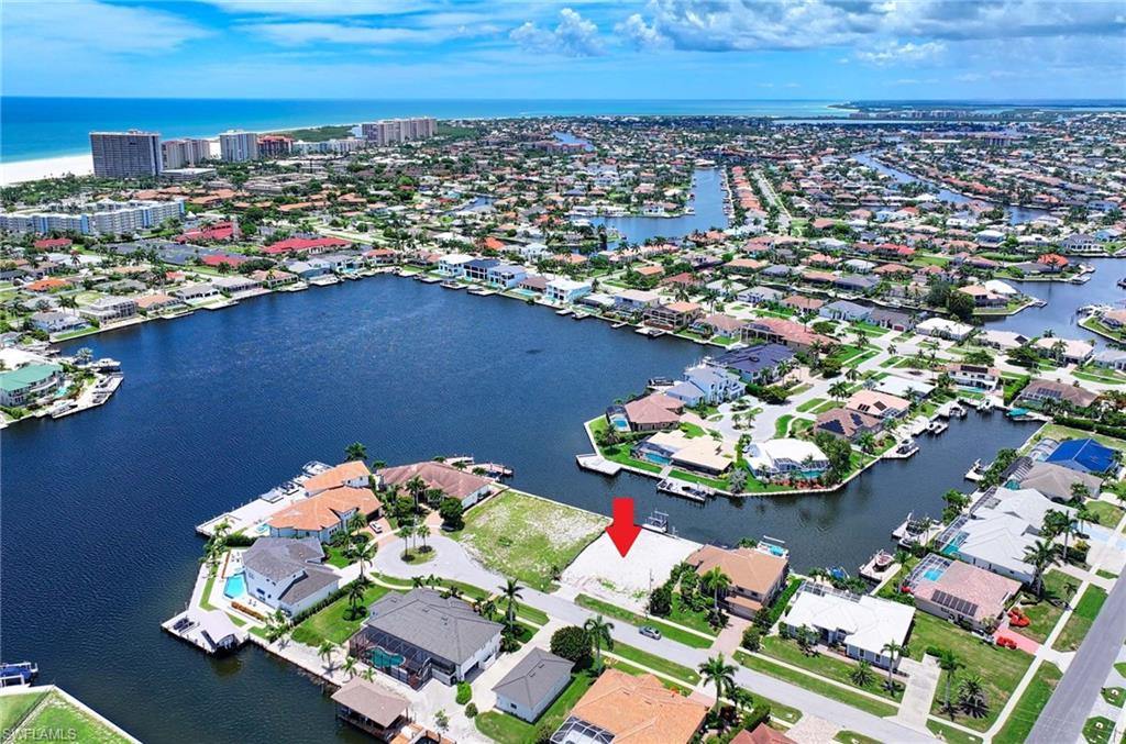 BUILD YOUR DREAM WATERFRONT HOME IN PARADISE! Located on a quiet cut-de-sac off San Marco & Lamplighter Drive in the heart of Marco Island, this exceptional cleared lot offers a rare opportunity to create your perfect coastal retreat. Just minutes from the beach and Residence Beach access, this 80x110 parcel boasts WIDE WATER VIEWS, a BRAND-NEW SEAWALL, and INDIRECT GULD ACCESS via Caxambus Pass-approx. 15 minutes out to open water through a quiet wake zone. Enjoy an EXISTING BEAUTIFUL DOCK, ideal for boating, kayaking or paddle boarding. With stunning open views and a tranquil setting, this homesite is ready for your custom-designed home-bringing your vision of INDOOR-OUTDOOR FLORIDA LIVING to life. This prime location offers convenient access to shops, dining, and entertainment while preserving the peace and privacy of waterfront living. Don't miss the chance to live your Marco Island Dream and make it the way you see it & want it!!!