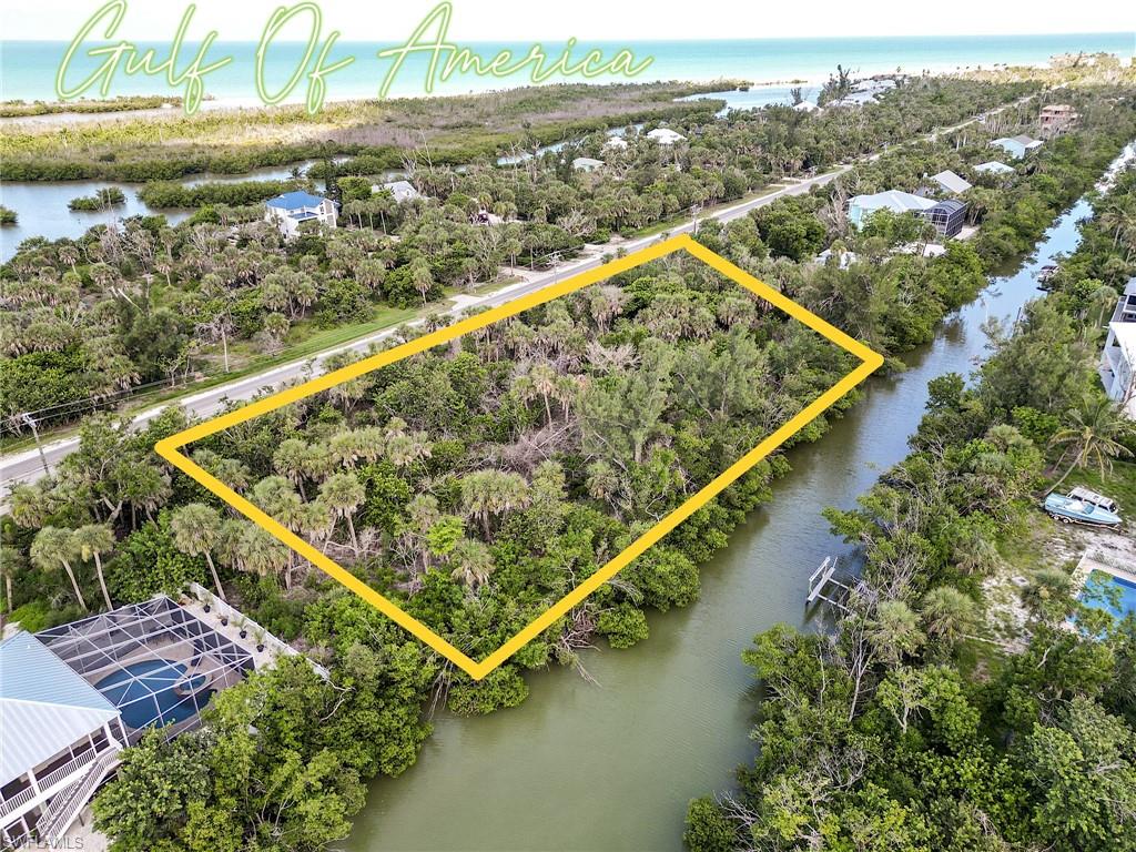 Welcome to 5706 Sanibel Captiva Road—arguably the best-priced waterfront property on Sanibel Island and one of the most substantial boating opportunities available across Sanibel and Captiva. Set on a commanding 1.39 acres with more than 300 feet of direct deep-water frontage, this is not merely waterfront property—it is front-row access to the intracoastal playground of Pine Island Sound and the open turquoise waters of the Gulf of Mexico.
The West End location offers an increasingly rare combination of privacy, acreage, boating access, and convenience. The property is just minutes by bicycle from the island’s renowned beaches, Blind Pass, and the historic Santiva enclave. A quick trip brings you to Captiva Island for waterfront dining, boutique shopping, and legendary destinations such as The Mucky Duck, The Green Flash, and the iconic Captiva Island Store.
Build here and position your future home for sweeping views toward the Gulf over Silver Key and sunsets that require no filter. Mangrove-lined shoreline, protected bayou waters, exceptional wildlife, and direct boating access create the kind of setting people spend years trying to find. The water here is not simply decorative—it is alive. Manatees cruise past the shoreline, dolphins regularly put on a show, and Snook, Redfish, Snapper, and Sheepshead make the surrounding waters a year-round fishery. Overhead, Osprey and Bald Eagles patrol the sky. It is nature’s highway, and this property gives you one of the best seats on it.
A property survey, marine survey, engineering study, and architectural plans for a custom approximately 3,000-square-foot elevated coastal residence, boat dock, and lift have already been completed and are transferable, representing a substantial savings of time and money already absorbed by the current owner. Simply put, buyers seeking the strongest waterfront value currently available on Sanibel should put this property at the top of their list.
This is not just another vacant lot. It is a launch point for early-morning fishing runs, sunset cruises, tarpon seasons, island weekends, and a lifetime on the water. For the buyer who views boating not merely as a hobby but as a way of life, this is home port.