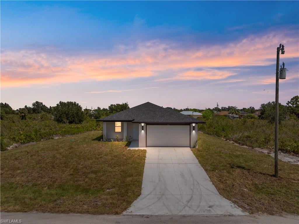 *Builder offering up to $10,000 towards buyers’ closing costs* Builder offering special financing incentives through preferred lender for qualified buyers, potentially including interest rate buy-downs, reduced lender fees, and other favorable terms. Terms, conditions, and qualification criteria apply. Looking for more space without breaking the budget? This brand-new construction home delivers incredible value with 3 generously sized bedrooms, 2 full bathrooms, and a thoughtfully designed open-concept layout that balances comfort, style, and affordability.The heart of the home is the modern kitchen, complete with a large center island, sleek cabinetry, and plenty of counter space—perfect for meal prep, entertaining, or gathering with family and friends. Open living and dining areas flow seamlessly together, creating a bright, inviting atmosphere. Step outside and enjoy a spacious backyard that’s ideal for pets, play, or weekend BBQs. Whether you’re dreaming of a garden, outdoor fun, or a private retreat, the possibilities are endless. Located just off Sunshine Blvd N and minutes from Lee Blvd, you’ll enjoy quick access to shopping, dining, schools, and major roadways—while still savoring peace and privacy at home. Affordable, spacious, and move-in ready—this home is a must-see in Lehigh Acres’ growing community. Schedule your showing today! Completed photos are from a previously sold model.
