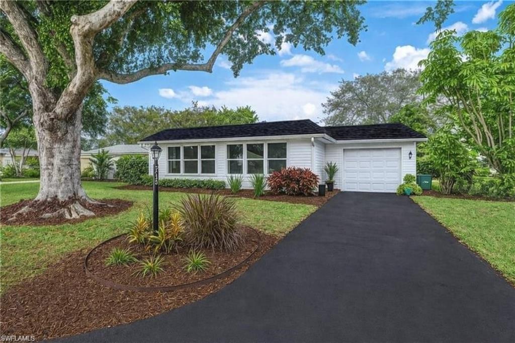 One or more photo(s) has been virtually staged, AI generated or rendered.  New Roof!! Lower hoa fees that include your insurance. Nice rental policy! So close to 5th Ave and the beaches.  Experience the perfect combination of privacy and community living in this beautifully renovated home. Every detail of the renovation has been thoughtfully executed, showcasing a stylish kitchen complete with white cabinets, stainless steel appliances, and stunning quartz countertops. The homeowners' association (HOA) offers an array of services, including flood insurance, water, sewer, landscaping, and garbage collection, providing a maintenance-free lifestyle while still enjoying the benefits of a detached single-family residence. The home features brand-new kitchen appliances, a modern AC unit, a water heater, and a washer and dryer, all enhancing your comfort. Expansive hurricane impact windows invite abundant natural light, melding contemporary luxury with timeless charm. Nestled on a quiet cul-de-sac, the open floor plan, complemented by carefully arranged furnishings, creates four distinct living areas that elevate your living experience. Conveniently located just 2 miles from Naples Beach and Pier, and 1.5 miles from the shops and restaurants of 5th Avenue, this property offers a serene retreat in the heart of Naples. Whether you're seeking a full-time residence or a seasonal getaway, you can simply lock the door and let the HOA take care of the rest. This is truly a rare gem in Naples. Please note, some photos have been virtually staged.
