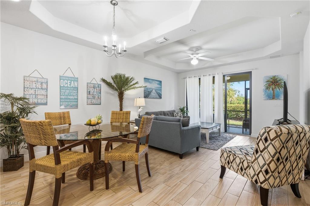 Welcome to this beautifully maintained 2-bedroom, 2-bathroom ground-floor condo in one of Southwest Cape Coral’s most convenient locations. The open-concept interior features over 9-foot ceilings with tray details and 8-foot doors, creating an open, airy feel. The kitchen features granite countertops, stainless steel appliances, wood cabinetry, and a breakfast bar for casual dining and entertaining. A stacked washer and dryer provide the added convenience of in-unit laundry. The spacious primary suite includes a generous walk-in closet, while the screened lanai provides a comfortable place to relax. Quality concrete construction, hurricane-impact windows and doors, and an attached garage offer added value and peace of mind. Residents also enjoy access to the community pool. With no rental restrictions, this property offers flexibility as a full-time residence, seasonal retreat, or investment opportunity. Located less than two miles from Cape Harbour’s waterfront dining, shopping, and entertainment, with groceries, restaurants, pharmacies, banking, and other everyday conveniences nearby.