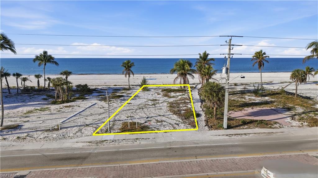 One or more photo(s) has been virtually staged, AI generated or rendered.  Beach Lover’s Gulf-Front Homesite – Live the Ultimate Coastal Lifestyle Embrace the true Fort Myers Beach lifestyle with this exceptional 50’ x 140’ +/- Gulf-front homesite offering direct access to miles of white sandy beach and breathtaking views of the Gulf of Mexico. Imagine starting your mornings with a peaceful walk along the shoreline, spending sunny afternoons enjoying the water, and ending the day with spectacular sunsets over the Gulf. This 50’ x 140’ +/- homesite provides the perfect canvas to design and build your custom beachfront retreat, where indoor and outdoor living blend seamlessly with the beauty of the coast. Create a home designed for relaxed beach living, entertaining, and capturing the natural beauty that surrounds you. Enjoy the tranquility, fresh sea breezes, and the rhythm of the waves that make Gulf-front living so special. Whether you're envisioning a luxury coastal escape or a laid-back beach house, this property offers the opportunity to bring your dream lifestyle to life. An optional adjacent parcel may also be available for purchase, providing the potential for a larger estate-style property or additional privacy. Builder referrals available for buyers ready to explore architectural design and construction possibilities. This is a rare opportunity to create your own Gulf-front sanctuary in one of Southwest Florida’s most desirable beachfront locations.