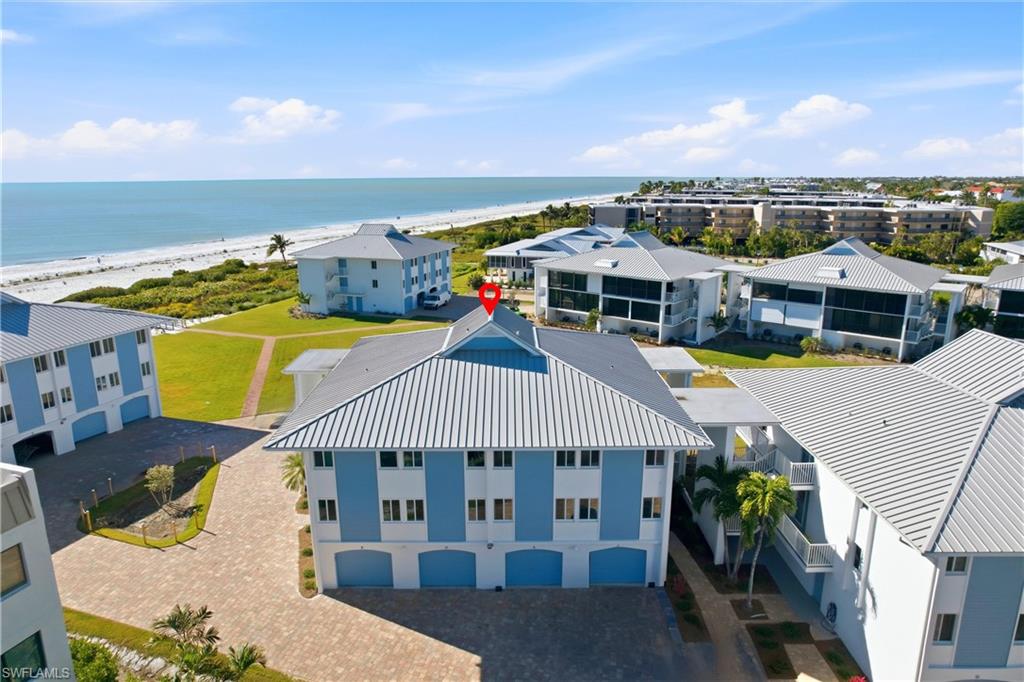 BIG Price Reduction!!  Amazing views from this top floor condo!! This totally redone 2 bedroom/2 bath condo is like brand new and has been completely remodeled. Master bedroom has own private bath and large walk-in closet. This condo features fabulous views of the Gulf in the highly desirable gulf front Sunset South development.  The entire complex has been updated since hurricane Ian. Extensive updates include new metal roofs on all units, exterior painting, new landscaping and updated pool and clubhouse.  This condo sits one building back from the beach and Gulf.  Interior of the unit was remodeled from the stud walls out including all new drywall, new electrical, new plumbing, new floorings, new kitchen including appliances, new bathrooms, new hurricane resistant Impact Glass sliding glass doors, new full size washer and dryer, and new lighting and ceiling fans. New garage doors and openers were installed as well as new AC units and water heater. Very unique features of this development are a one car under building garage and large locked storage unit for beach chairs, umbrellas, cooler, bikes and any other items. The condo is being sold turnkey so just bring your clothes and a toothbrush and you will be ready to live the SW Florida beach lifestyle on tropical Sanibel Island. Just a short walk to the beach over the private walkway to one of the top shelling white sand beaches in Florida.