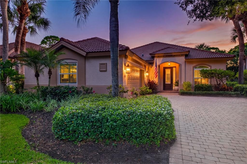 Located in the highly sought-after cul-de-sac of Gleneagles in the amenity-rich Bundled Community of Pelican Sound. Tastefully updated and meticulously maintained, this stunning single-family home with the desirable 2.5 car garage offers an oversized lot, & the perfect blend of luxury, comfort, & thoughtful design. The popular Ridgewood floor plan features an open-concept great room layout, volume ceilings, centered around a beautifully renovated kitchen that's truly the heart of the home. Highlights include granite countertops, 42-inch maple cabinetry with soft-close doors and drawers, stainless steel appliances, travertine tile backsplash, under & over-cabinet lighting, and an extra-tall custom pantry with pull-out shelving.  Freshly painted interior showcases crown molding, travertine tile flooring, plantation shutters, volume ceilings, and a built-in speaker system throughout the main living area. The spacious primary suite offers a tray ceiling, a custom walk-in closet system, private lanai access, and a luxurious renovated bath featuring a steam shower with multiple shower heads, 4 body sprays, a frameless glass enclosure, dual sinks, a vanity with granite countertops, soft-close cabinetry, and a custom linen closet. The split bedroom floor plan provides privacy for guests, who will enjoy an updated bath with a frameless glass shower and granite-topped vanity.  A versatile den with a pocket door serves as the perfect home office, with custom built-in cabinetry, granite countertops, bookshelves, file drawers, pull-out shelving, and a mounted 60-inch television. The well-appointed laundry room includes custom cabinetry, quartzite countertop, an oversized sink, and newer LG front-loading washer and dryer.  Outdoor living is exceptional on the expanded lanai featuring electric hurricane screens, a picture-frame screen enclosure with no-see-um screening and enhanced structural supports, newer brick paver patio, large above-ground spa, and sparkling in ground pool. The pie-shaped lot offers a private outdoor setting, with preserve and golf course views, creating the perfect backdrop for relaxing or entertaining while enjoying Southwest Florida's year-round lifestyle. Enjoy peace of mind with hurricane windows, A/C in 2024, water heater in 2026, a reverse osmosis system, and a Nest thermostat. No detail has been overlooked in this impeccably maintained home! If you are looking for an active lifestyle, look no further: 27 holes of Championship golf, 16 pickleball, 8 tennis, and 6 bocce courts. A state-of-the-art fitness center, professionally staffed. Pelican Sound is nestled along the Estero River, with access to the Gulf. The community offers dry boat storage, kayaks, canoes & paddle boarding, along with a shuttle boat to Lovers Key State Beach Park. Minutes from RSW International Airport & surrounded by fabulous shopping and restaurants.