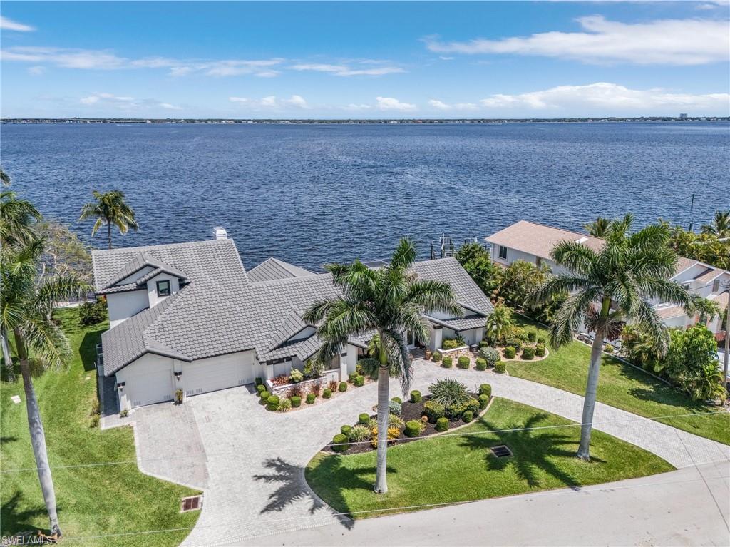Discover the epitome of riverfront living on ALMOST 1/2 ACRE of riverfront property in this meticulously remodeled home, perfect for those who crave life by the water. In 2014/2015, this gem was transformed into a luxurious haven, featuring 3 en-suite bedrooms, 2 guest rooms, and 4 full baths with an additional half bath by the pool. The upstairs master suite boasts breathtaking river views, a private balcony, a massive walk-in closet, and a spa-like bathroom with a jacuzzi tub and walk-in shower.
This cook's dream kitchen is a masterpiece with custom cabinetry, a striking copper farmhouse sink, a walk-in pantry, and a sprawling breakfast bar that opens to an inviting gathering room complete with river views and a wood-burning fireplace. Every detail shines with modern updates, including new plumbing, electrical systems, two A/C units, hot water heaters, resurfaced pool with glass tile, flagstone pool deck, and roof. Outside, your riverfront oasis awaits with a concrete captain’s walk spanning the width of the .49-acre lot, with room for your largest water crafts.

The oversized 3-car garage provides ample storage for all your needs, while hurricane protection, including impact glass and Astroguard fabric panels, ensures peace of mind. This unique property offers expansive river views from every angle and the best neighborhood for making unforgettable memories. Don’t miss this one-of-a-kind riverfront retreat—designed to delight water lovers and accommodate both families and friends with room to spare.

Best spot in town (tarpon hole in your back yard) watch the Dolphins and Tarpon Roll....your own back yard SEAWORLD EVERY DAY.

AMERICAN HOME SHIELD ONE YEAR WARRANTY PAID WHICH COVERS:
POOL PUMP, 2 WATER HEATERS, 2 AIR CONDITIONERS, ALL APPLIANCES, INTERIOR PLUMBING, ELECTRICAL
LOTS OF ROOM TO ADD AN RV GARAGE OR EXTRA GARAGE FOR TOYS
NEVER FLOODED AND TRANSFERRABLE FLOOD INSURANCE $3890 ANNUALLY, PAID THRU JUNE 2027