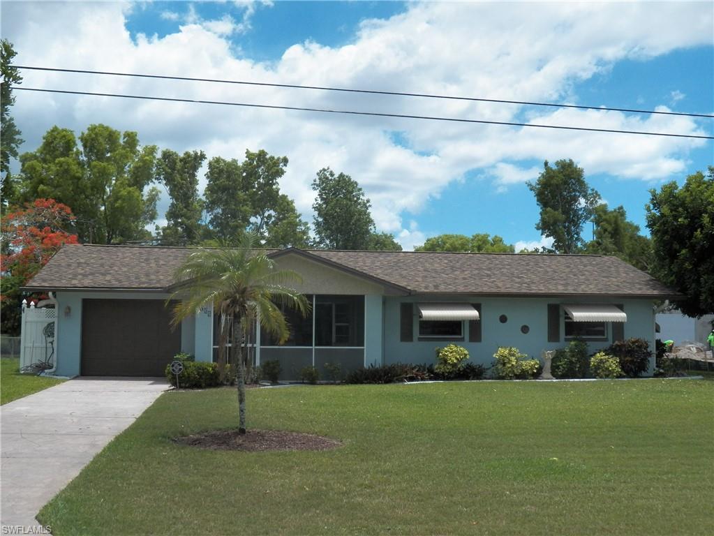 Price improvement! Excellent opportunity to buy and live in a POOL home with a pretty landscaped backyard with a privacy wall, a large shed and fruit producing banana trees.  An open floorplan greets you from the screened & tiled front entry where you can sit and enjoy morning coffee or tea. Some great features are the new laminate floors, new bathroom vanity tops, lights & fresh paint. There is tile in the kitchen and baths, a new roof (2023) and new pool cage (2024), and the windows have roll down, accordion and awning hurricane shutters. The large screened lanai and SOUTHERN exposure POOL have a nice big deck area just waiting for your lounge chairs.  The home has never flooded, not even in Hurricane Ian. Come take a look!