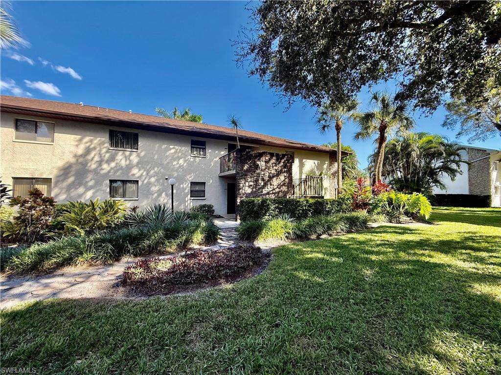 Popular Stone Edge Condominium, TWO BEDROOM TWO BATH GROUND FLOOR UNIT LOCATED IN THE REAR BUILDING, QUIET AND PRIVATE, 55+ COMMUNITY, no pets, newer LUXURY VINYL PLANK FLOORS, NEWER KITCHEN CABINETS AND GRANITE COUNTERTOPS, TILE BACKSPLASH, LED LIGHTING, breakfast bar open to the living room, split floor plan with primary suite in the back of the condo overlooking the nicely landscaped grounds, COMMUNITY POOL AND TENNIS COURTS, guest bedroom located at the front of the unit, COVERED CARPORT  PARKING, screened front entryway, NEW ELECTRICAL PANEL BOX IN 2026, NEWER CENTRAL HEAT AND AIR IN 2019, primary suite with access to the screened lanai, large walk in closet, GRANITE vanity top in primary bath with tiled walk in shower, sliding doors from the living room to the screened lanai, perfect location, just steps to the community pool and tennis courts, indoor laundry room with full size washer and dryer, low monthly maintenance fee of $295. Located within walking distance to Homestead Rd and just minutes to I-75, Ft Myers and the SWFL International Airport. NO FLOOD INSURANCE REQUIRED. LEHIGH IS LOCATED IN THE HIGHEST ELEVATION IN LEE COUNTY.