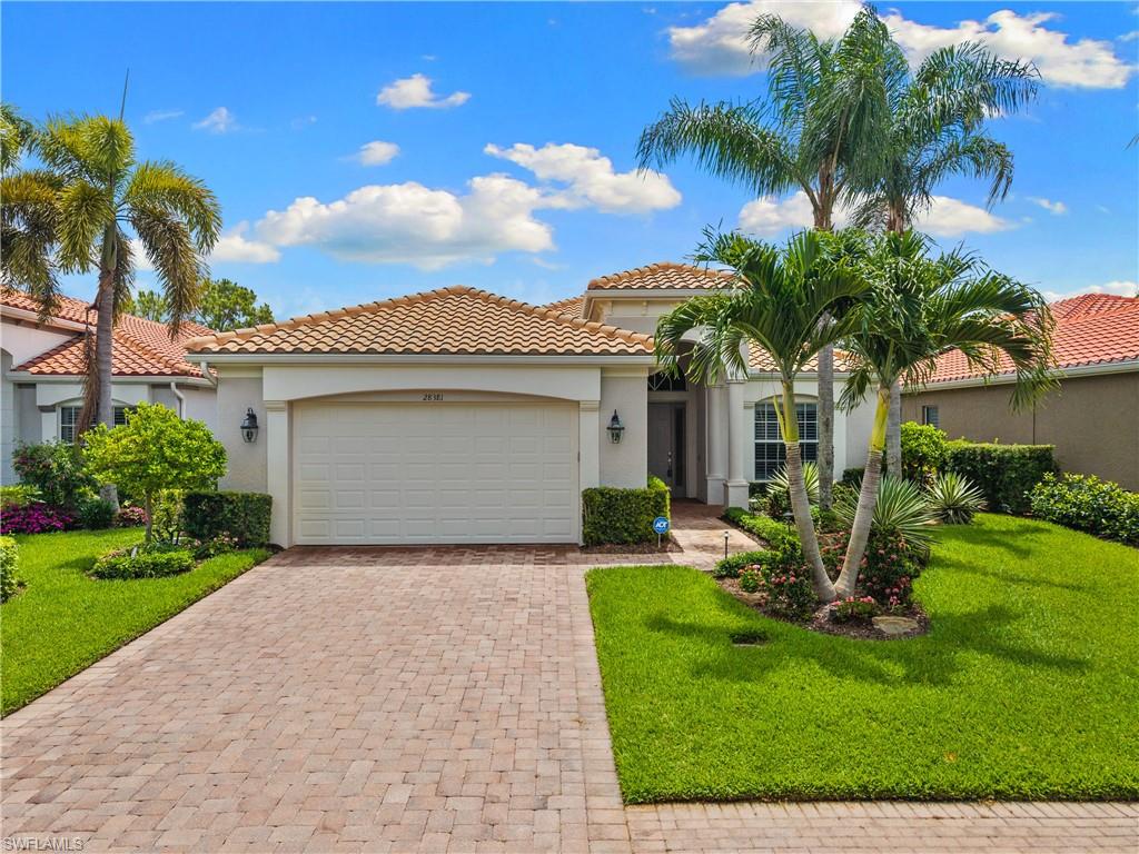 GOLF MEMBERSHIP INCLUDED! Beautifully renovated and showing like a model, this Vasari Country Club pool home delivers an exceptional combination of modern finishes, golf course views, resort-style outdoor living, and bundled golf value in one of Bonita Springs’ most convenient and sought-after locations. From moment you enter the front door, the home feels fresh, bright, and elevated with soaring ceilings, crisp white walls, contrasting dark plank flooring, plantation shutters, designer lighting, and a clean coastal-modern design throughout. The open-concept kitchen is a true centerpiece, featuring white cabinetry, stainless steel appliances, marble-look counters and backsplash, a large island with breakfast bar seating, and seamless flow into the main living area and lanai. The primary suite opens directly to the pool through French doors and features a beautifully renovated bath with wall-to-wall tile, a glass-enclosed shower, freestanding soaking tub, floating-style vanity, and spa-like finishes. The guest bath has also been tastefully remodeled. Outside, the picture-window screened-in lanai feels like a private resort retreat with a covered seating area, outdoor TV, upgraded natural travertine pool deck, new coping, redesigned waterfall features, and lush tropical landscaping that frames the peaceful golf course views beyond. Additional upgrades include Storm Smart electronic Kevlar hurricane shutters, fresh interior paint, new flooring throughout, custom landscaping, and landscape lighting. Vasari is a highly desirable bundled golf community west of I-75 near the Naples border, offering golf membership with ownership and allowing buyers to avoid the $100,000+ initiation fees and long waiting lists found at many area clubs. Beyond golf, Vasari offers an active and welcoming country club lifestyle with something for everyone, including clubhouse dining, tennis, bocce, fitness, social events, community gatherings, and a thriving pickleball program. All of this is located just minutes from some of our best beaches, dining, shopping, and entertainment options. Schedule your private tour today and experience one of the best renovated pool home opportunities here in Southwest Florida!
