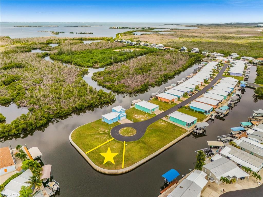 Discover Treasure Cove, Pine Island’s newest waterfront community, with fast, deep-water access to San Carlos Bay and the Gulf of Mexico. Designed with boaters in mind, Treasure Cove offers an exceptional location for fishing, cruising, and enjoying the Southwest Florida waterfront lifestyle. YOU MUST CHECK OUT THE VIDEO FLYOVER IN THE VIRTUAL TOUR. The community features low HOA fees, central water and sewer, and new homes built to today’s elevation standards to help reduce flood risk. Choose a complete home-and-lot package or purchase your waterfront homesite separately and build when you’re ready—there is no required timeline to begin construction. All home plans are subject to HOA approval. Secure your place in this new Pine Island waterfront community and start planning the home—and boating lifestyle—you’ve been waiting for.
