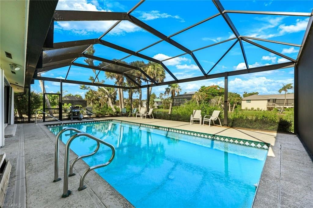 Available November &  December 2026.  STREET LEGAL GOLF CART INCLUDED FOR ANY 2026 BOOKING!  Beautifully remodeled 3-bedroom, 2.5-bath pool home in Sanibel's desirable East Rocks neighborhood, just moments from West Gulf Drive and the island's world-famous beaches. Thoughtfully updated throughout, this home offers an open, light-filled floor plan with beautiful lake views, luxury vinyl plank flooring, quartz countertops, stainless steel appliances, coastal furnishings, and a spacious living area designed for comfortable island living.

Step outside to your private screened pool and expansive lanai overlooking the peaceful freshwater lake, the perfect place to enjoy your morning coffee, relax after a day at the beach, or entertain family and friends. The quiet residential setting offers the privacy many visitors are looking for while remaining just minutes from shopping, restaurants, bike paths, and Sanibel's spectacular shelling beaches.

Additional features include a spacious primary suite, beautifully updated bathrooms, in-home laundry room, two-car garage, bicycles and beach equipment for guest use, high-speed Wi-Fi, and a fully equipped kitchen. Whether you're planning an extended vacation, working remotely from paradise, or simply looking to experience island life at a slower pace, this home provides everything needed for a memorable stay.