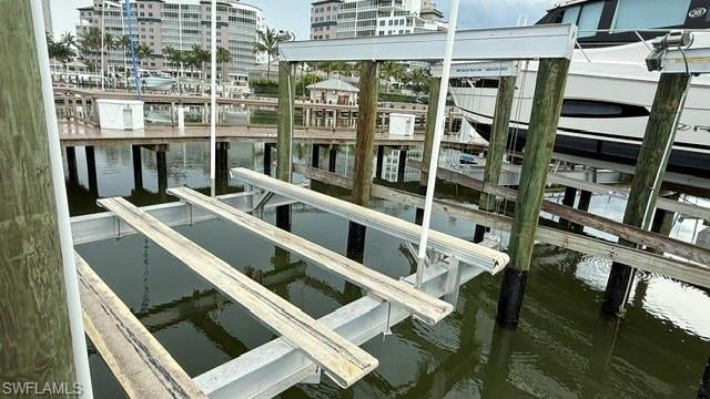 Only 1 mile to the Gulf through Wiggins Pass which is currently being dredged out. This slip at Pelican Isle Yacht Club is located in the basin on the north side with very convenient nearby parking. The slip offers a 27,000# lift and will accomodate up to a 45' boat with a beam of 14'. water and 2 - 30 amp electric at the slip which is billed quarterly. Pumpout services are available and delivery of ice and water upon request. Amentities included Tennis, Pickleball, Bocce, Fitness Center, Beach Shuttle, Dining, Resort Style Pool, and Bar. The best part, you have National Reciprocity with YCA, Local Reciprocity with FCYC, and Summer Reciprocal Dining and Golf at local SW Florida Clubs.