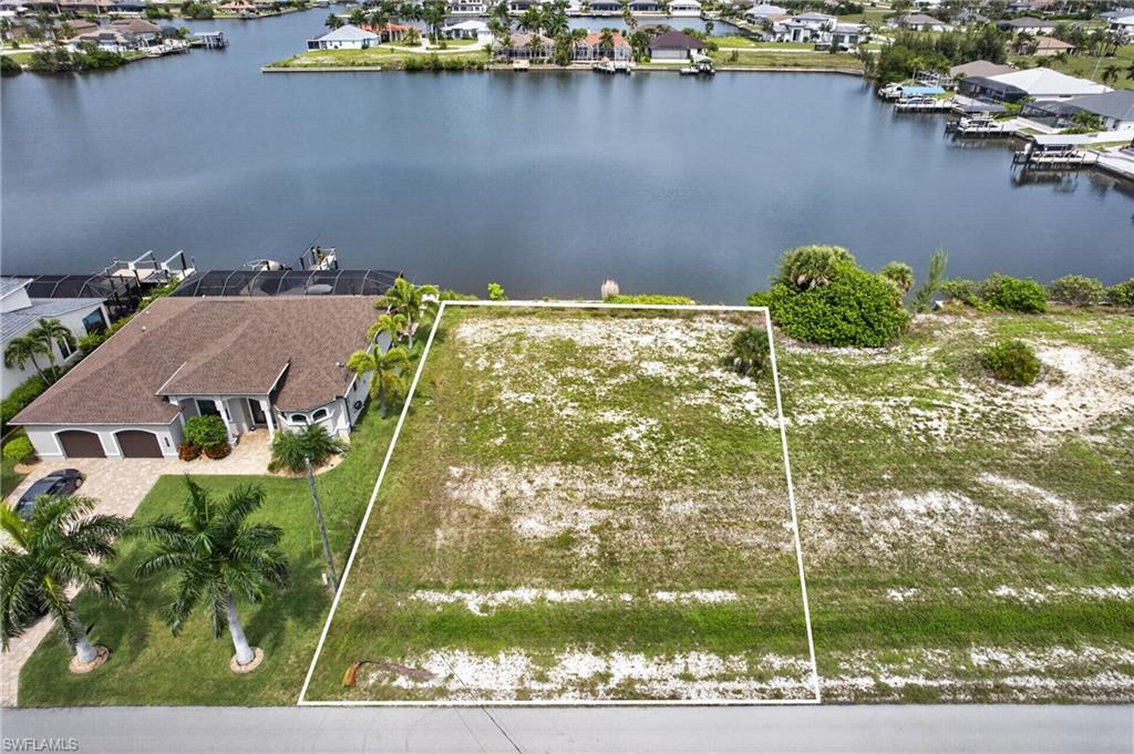 Create the waterfront home you’ve always envisioned on this exceptional DIRECT GULF ACCESS homesite with breathtaking views across beautiful Lavedo Lake. Offering 80 feet of LAKE FRONTAGE this premium lot is ready for construction with an existing SEAWALL already in place—a valuable improvement of approximately $30,000.

With NO BRIDGES between your dock and open water, you’ll enjoy effortless boating access through Matlacha Pass to the Gulf of Mexico. Spend your days fishing, island hopping, waterfront dining, or cruising some of Southwest Florida’s most spectacular waterways.

The expansive lake views provide the perfect backdrop for a one-of-a-kind custom home designed to impress. Whether you envision a luxury estate with panoramic outdoor living spaces or a modern waterfront retreat, this property offers the setting to make it a reality.

Located in the fast-growing northwest Cape Coral area, this is a rare opportunity to secure a premium Gulf access lot with wide water views, an existing seawall, and unrestricted boating access. Waterfront lots of this caliber are becoming increasingly difficult to find—don’t miss your chance to build something truly extraordinary.