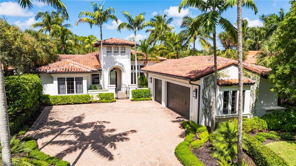 Welcome to this beautiful 3-bedroom plus den villa in the highly desirable Cortile neighborhood of Mediterra. Freshly painted inside and out, this exceptional home features a spacious Great Room design and effortless indoor-outdoor living—perfect for enjoying the Southwest Florida lifestyle.

Impact sliding glass doors open from the Kitchen Nook to expansive covered outdoor living spaces overlooking serene lake and preserve views. Entertain guests while watching spectacular sunsets, take a dip in the private pool, or unwind in the built-in spa.

The professional kitchen is designed for both everyday living and entertaining and features gas cooking. Outside, the well-appointed outdoor kitchen also offers gas cooking, making al fresco dining a breeze. Automated screens provide added comfort and flexibility in the outdoor living area.

Custom details throughout the home include painted wood ceilings, beautiful wood flooring, and a striking custom entertainment wall in the Great Room. Additional features include an air-conditioned garage, dedicated wine room, and more.

Experience the very best of Southwest Florida living with Mediterra’s exceptional amenities, including two championship golf courses designed by Tom Fazio, a stunning private beach club, restaurants, and an exciting new sports complex coming soon with fitness center, casual dining, lifestyle rooms, spa, and more. Residents also enjoy 7 pickleball courts, 8 tennis courts, and 4 bocce courts—offering an unmatched active lifestyle. This is luxury living at its finest