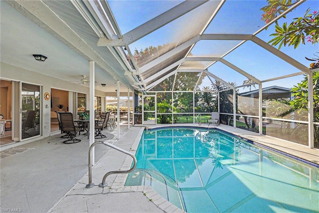 160 FEET OF WATERFRONT. NO BRIDGES. YOUR BOAT, YOUR POOL, FURNISHED HOME - YOUR FLORIDA LIFESTYLE IS READY! New Roof 2022, New A/C 2024, New Pool Heater and New floors. ~Boaters, this is the one that deserves your attention! Imagine stepping outside, firing up the boat, and being on the river in about 3 MINUTES. No bridges to navigate. No long ride to open water. Just pure Southwest Florida boating freedom! ~Tucked away on a quiet cul-de-sac, this fully updated Gulf-access pool home delivers the waterfront lifestyle you are searching for, with features that are getting harder to find. How about 160 FEET OF WATERFRONT, SAILBOAT ACCESS, and a 15’ x 30’ BOATHOUSE with dock? Now we're talking! ~Inside, the bright, open great room brings the pool views right into your everyday living. The modern kitchen features granite countertops, newer appliances, an induction cooktop, and a breakfast bar made for morning coffee, casual lunches, and entertaining your favorite people. ~Outside? Your own private Florida escape! Enjoy the heated pool, relax beneath the screened lanai, and take in the lush tropical landscaping. Add a 2022 metal roof and a furnished, move-in-ready feel, and you've got more time to enjoy the water and less time worrying about what's next. ~If waterfront living means more than just looking at the water from your backyard, put this one on your must-see list. Your next boat ride could be just minutes from your back door! Who’s ready to make waves?