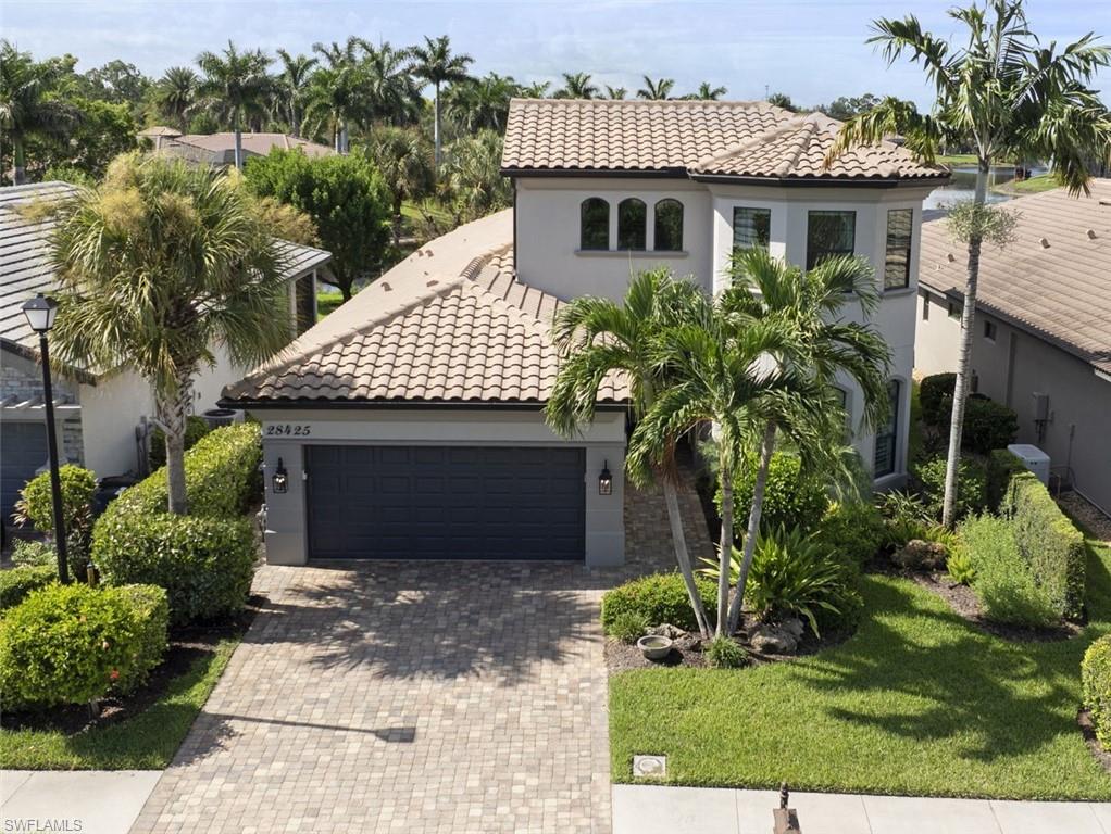 Your are looking at one of the finest homes ever built within Spanish Wells - This home "checks all of the boxes" !

Starting with a Southern exposure looking at those tranquil Lake views.... both setting the stage for this SPACIOUS 4-bedroom plus den, 3.5 bath residence located within the Cordova community of Spanish Wells. 

Offering over 3,000 square feet of living space this thoughtfully designed home blends generous indoor living areas .....with a resort-inspired outdoor screened Pool/Spa area looking South over the Lake. 

Inside, tray ceilings and plantation shutters add architectural character throughout the home, with Tile and Wood  flooring in the main living areas and Carpet in the bedrooms. The kitchen is designed for both everyday living and entertaining, featuring quartz countertops, stainless steel Whirlpool appliances, a five-burner GAS cooktop, and a large island with breakfast bar seating....and adjacent to a spacious Pantry.

The primary suite offers a private retreat with a Tray ceiling, Bay windows and direct access to the Pool area. 
Two walk-in closets provide abundant storage, while the updated primary bath features dual vanities, a separate soaking tub and walk-in shower. There are a total of "3" additional bedrooms, a den and 3.5 baths which provide plenty of flexibility for guests (see 2nd floor features) or possibly a Home Office.

The 2nd floor has a bedroom and full bath, PLUS a "spectacular "Guest/Theater bedroom which sleeps "5""....with a 100" TV ! (Think "GRAND CHILDREN").... See photos 

Designed to take full advantage of its Southern Exposure and Lakefront setting, the screened lanai area features a heated Pool and Spa surrounded by Travertine flooring. A built-in BBQ Grill and mini Refrigerator make outdoor entertaining effortless, while a private Outdoor Shower and convenient pool Bath complete the space. 

Additionally, "Storm Protection" features include a whole house "Generac" Generator, Impact Glass storm resistant  sliding glass doors and windows, ... plus an electric roll-down Storm Proof Screen Shutter covering the entire under roof  lanai area, 

This home has "3" Air Conditioning systems.....all are new or almost new... one of the A/C systems air-conditions the "oversized" garage (2 cars+golf cart+workshop, etc.) which has Epoxy Flooring + built-in Overhead  Storage. 

This spectacular Cordova Home comes with a "CLUB AMENITIES MEMBERSHIP'.....which includes Full Access to the Clubs many recreational and social features (Tennis, Pickle Ball, and Bocce Courts, plus the "staffed" Fitness Center and main Pool) and also includes Discounted Golf Rates....plus you have the opportunity to "upgrade" to a "Full Golf Membership" !

This is an an exceptional opportunity to enjoy spacious Lakefront Living and the Florida Lifestyle, yet being only 3 miles from our Public Beaches, 10 miles from Downtown Naples, and 18 miles from the International Airport.

....don't let this one get away !