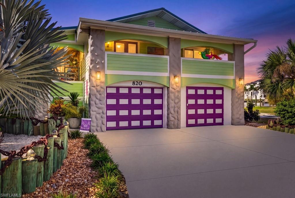 Welcome to “ParrotEyes”, one of the most unique properties on Fort Myers Beach.  This meticulously remodeled Key West-style cottage offers an exceptional blend of location, island charm, boating access, and investment potential, within steps of the island’s best entertainment and restaurants. This unique property is zoned multi-family and features two separate living levels with a total of 4 bedrooms, 4 full bathrooms, and one of the coolest outdoor spaces on the island, complete with a tiki hut, in ground salt water pool, outdoor bar and direct Gulf-access canal. Designed for flexibility and the ultimate Florida lifestyle, the home features two separate living levels. The upstairs living space offers 2 bedrooms, 2 full bathrooms, a spacious kitchen with a large center island, and expansive front and rear-covered porches perfect for relaxing and entertaining your guests. Take in the coastal breezes and canal views from the rooftop deck, an ideal spot to unwind after a day on the water. The ground level has it's own separate entrance and will be delivered turnkey.  It offers an additional 2 bedrooms and 2 full bathrooms, along with a covered lanai overlooking the pool and canal. This versatile layout provides outstanding flexibility for investors seeking rental income while enjoying the property themselves, or for families looking for a spacious coastal retreat with room for everyone. Rent one unit and use the other! Boating enthusiasts will appreciate the 13,000-pound covered boat lift and direct Gulf-access canal, putting the open waters just minutes away, with easy access to Sanibel and Captiva Islands. Whether you're searching for an investment opportunity, a use-some-and-rent-some property, or a unique family getaway, Parrot Eyes delivers a rare combination of character, versatility, and the Fort Myers Beach lifestyle. Discover a truly special island property where boating, relaxation, and coastal living come together.