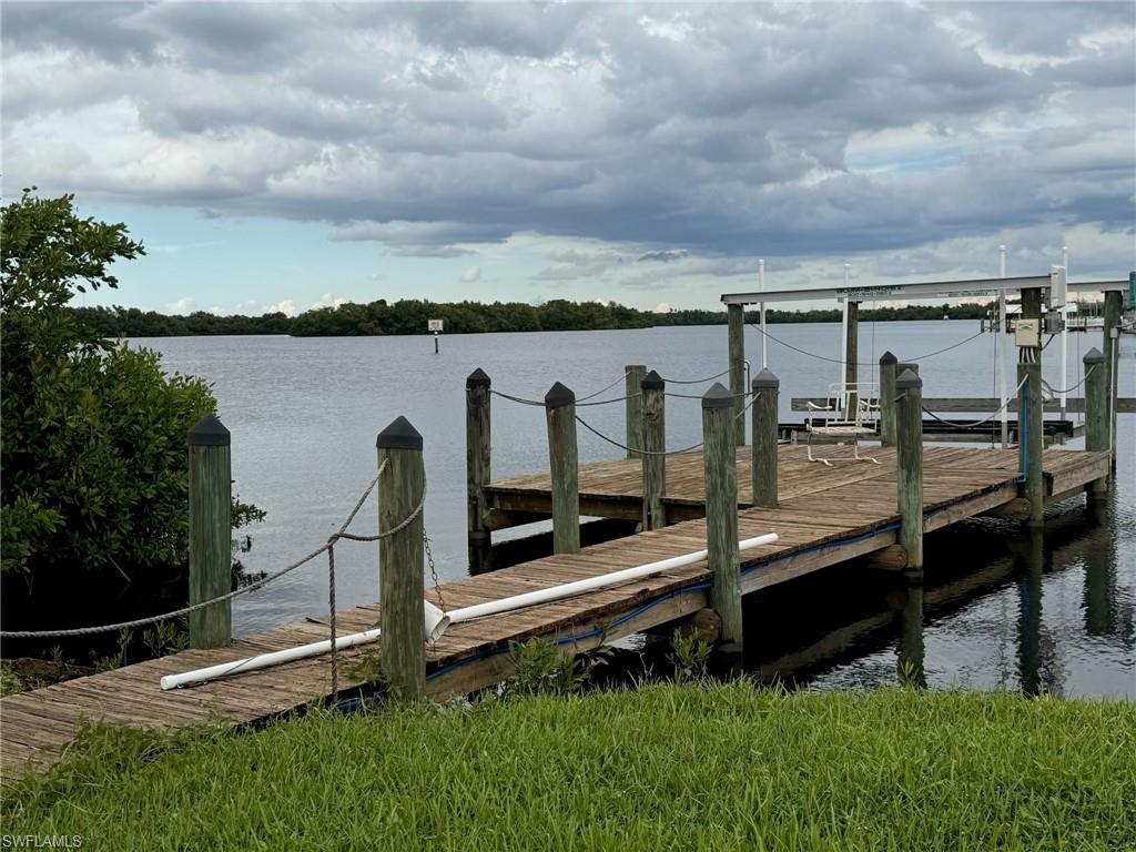 Want a beautiful view of the Caloosahatchee River where the Orange River meets?  You will have it with this lot/share, which includes a wooden pier and boat lift!  The water is a bit deeper here so the tide shouldn't be much of a problem for you: depending on your boat size of course! The lot is 45’ wide by 53’ deep - large enough to place a 1,400 sq. ft. dream home.  The low maintenance fee of $406 per month includes water, sewer, lawn care, trash and recycle.  The community clubhouse and pool are located just down the street for your convenience.  Some of the amenities include, but not limited to: Pickleball, Bocce ball, Basketball, Shuffleboard, Billiards, and ping pong to name a few.  Orange Harbor is a pet friendly park with certain breed/weight limits not allowed, so be sure and check out the rules.  Orange Harbor Co-op is located just 7 miles from 
downtown Fort Myers with grocery and other amenities nearby.
