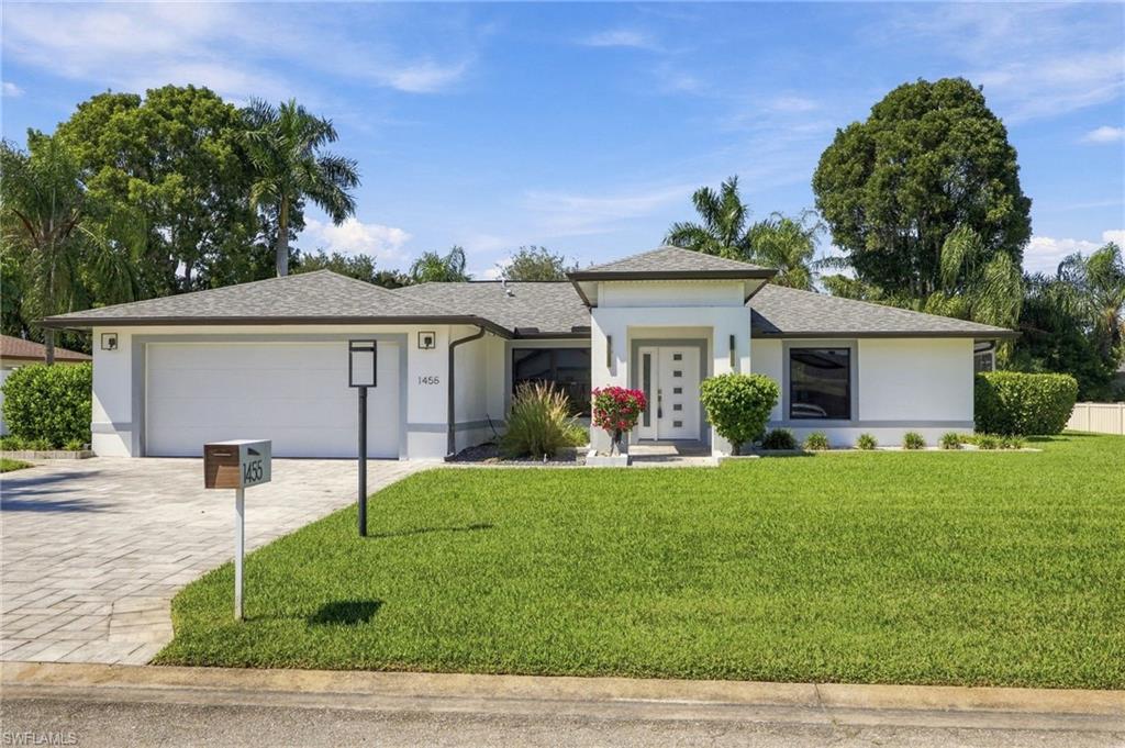 Completely renovated and move-in ready, this stunning Whiskey Creek home seamlessly blends modern style, comfortable living, and exceptional outdoor entertaining. Offering over 2,000 square feet of living space, this thoughtfully designed residence features an open-concept floor plan, contemporary finishes throughout, and a bright, welcoming atmosphere that makes you feel right at home. 

The spacious kitchen features stainless steel appliances, waterfall countertops, and sleek cabinetry with open access to both living and dining areas. Luxurious tile flooring extends throughout the entire home, providing a clean, cohesive look while offering durability and easy maintenance. The adjacent dining space is large enough to seat the whole crowd, while still feeling cozy due to the added fireplace feature. 

With three bedrooms and three full bathrooms, this home provides plenty of space, privacy, and flexibility for family members and guests alike. A true split plan offers everyone in the home their own suite. The primary suite is extended to provide a very large walk-in closet with built out storage- truly one of it's kind! The square footage and additional full bath set this one apart from the rest. 

The impressive outdoor living space features a large saltwater swimming pool and private spa, all nestled within a screened enclosure for year-round enjoyment. An oversized lanai offers ample room for lounging, dining, and relaxing, while the expansive outdoor kitchen is ideal for hosting gatherings, enjoying weekend barbecues, or simply making the most of the Florida lifestyle. The outdoor area includes both fully covered, and 

Located in the desirable Whiskey Creek community, this beautifully updated home offers the perfect combination of modern comfort, spacious interiors, and exceptional outdoor amenities. An added bonus: the property is not located in a flood zone.