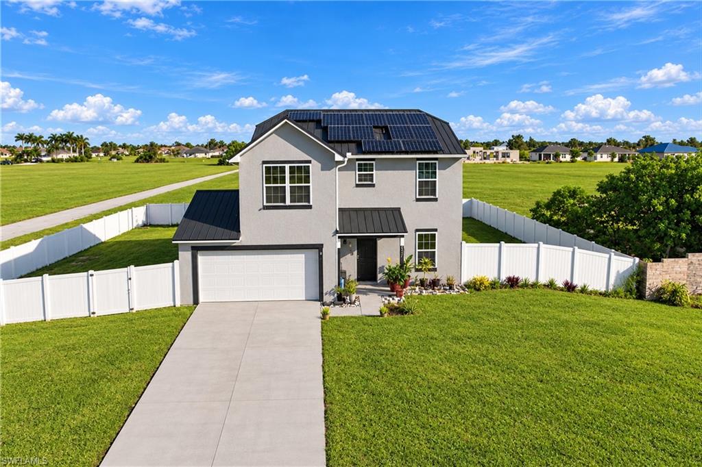 Discover the perfect blend of space, comfort, and modern convenience in this charming two-story home! Built in 2018, this home offers 3 bedrooms, 2.5 bathrooms, and 1,709 square feet of living space on an expansive 0.32-acre fenced lot, providing added privacy and plenty of room to enjoy outdoor living.
The thoughtfully designed first floor features a separate den off the foyer, ideal for a home office, study, or potential additional bedroom, along with a private living room perfect for relaxing or entertaining. The inviting great room flows seamlessly into the dining area and kitchen, creating a comfortable space for everyday living and gatherings.
Upstairs, the owner's suite offers a private bathroom and walk-in closet. Two additional bedrooms, a full bathroom, and a loft that has been converted into an additional bedroom provide flexible living arrangements to accommodate a variety of needs.
Additional features include an attached two-car garage, central air conditioning, and solar power with a Tesla charging station. The metal roof was replaced in 2023, adding lasting value to this well-maintained property.
With its versatile floor plan, spacious fenced yard, solar features, and convenient living spaces, this home presents a wonderful opportunity for homeowners seeking comfort, functionality, and room to grow!