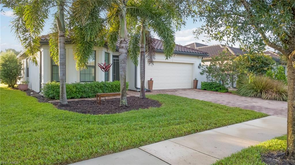 STUNNING POND & GOLF COURSE VIEWS WITH A PRIVATE HEATED SALTWATER POOL! Welcome to this beautifully upgraded home in Del Webb Naples, featuring 2 bedrooms, a den, and a sunroom that seamlessly extends the main living space. Open to the kitchen, the light-filled sunroom creates an inviting additional gathering area, perfect for relaxing, entertaining, or enjoying the picturesque views.

Step outside to your screened pool lanai, where a heated saltwater pool 14 x28 overlooks the tranquil pond and golf course. A Storm Smart hurricane protection screen adds convenience, privacy, shade, and peace of mind.  Impact windows and doors are also on the entire home.

Inside, you'll appreciate tile flooring throughout, plantation shutters, impact glass, and custom-designed closets and pantry that maximize storage and organization. Additional features include a security system and a unique pass-through laundry chute connecting the primary bathroom directly to the laundry room!

Thoughtfully designed for both everyday comfort and entertaining, this home combines beautiful indoor living spaces with exceptional outdoor enjoyment. Located in the sought-after 55+ community of Del Webb Naples, residents enjoy resort-style amenities, fitness facilities, pickleball, tennis, golf opportunities, and an active social calendar.

Exceptional views, a seamless air-conditioned sunroom, and your own private pool—experience the best of the Del Webb Naples lifestyle!   Hop on your golf cart and head into the charming town of Ave Maria for restaurants, shopping, farmers markets, concerts, and year-round community events. Here, neighbors become friends, every day feels like a vacation, and life moves at just the right pace. Why wait months for new construction when you can enjoy one of Southwest Florida's most sought-after 55+ communities today? Ave Maria ~ Once you get here, you get it.