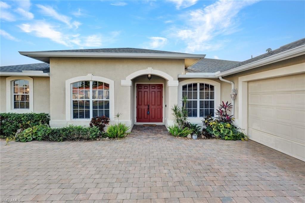 Welcome to this beautifully maintained pool home in the desirable Eagle Ridge community, known for its low HOA fees that include fiber internet. Set amid mature palm trees and lush tropical landscaping, this home offers outstanding curb appeal, a welcoming paver driveway, and the peace of a well-established neighborhood. A newer roof, providing added value and peace of mind.
Inside, the open and airy floor plan features a spacious great room with an elegant tray ceiling, neutral tile flooring, and large sliding glass doors that create seamless indoor–outdoor living. The bright white kitchen includes granite countertops, stainless-steel appliances, abundant cabinetry, a breakfast bar, and a cozy dining nook with pool views.
The expansive primary suite offers direct pool access, crown molding, two large walk-in closets, and a spa-inspired bathroom with dual vanities, a soaking tub, and a separate walk-in shower. Two additional guest bedrooms and a beautifully updated bath provide comfort and flexibility for family and visitors.
Step outside to your private tropical oasis: a sparkling screened-in pool surrounded by vibrant landscaping for exceptional privacy and year-round enjoyment.
Perfectly located just minutes from the Eagle Ridge public golf course, RSW International Airport, Fort Myers Beach, shopping, dining, healthcare, and nearby tennis facilities, this home blends convenience with the relaxed Southwest Florida lifestyle.
With its inviting layout, tropical outdoor retreat, and unbeatable location, 7830 Twin Eagle Lane is a must-see in one of South Fort Myers’ most charming communities.