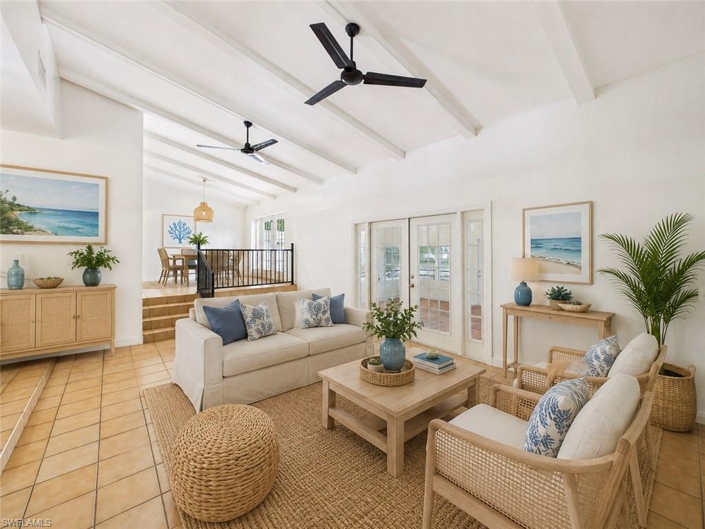 Tucked away on a quiet cul-de-sac in one of North Fort Myers’ hidden waterfront pockets, this GULF ACCESS, mid-century modern gem feels like the kind of home where life naturally slows down and every sunset becomes part of your routine. From the moment you arrive, the huge semicircle driveway, lush surroundings, and warm architectural character create a sense of privacy and charm that’s hard to find. NO FLOOD INSURANCE NEEDED! Save thousands of dollars while still enjoying the waterfront lifestyle. A quick half-mile walk to the North Fort Myers Community Pool makes this location stand out.

Inside, vaulted ceilings with exposed wood beams, authentic Mexican tile, French doors, and thoughtfully preserved mid-century modern touches give the home a timeless personality that feels both stylish and inviting. Natural light pours through the home, especially in the enclosed Florida room offering approximately 300 square feet of additional living space — the perfect spot to relax with morning coffee, host friends, read a book, or simply enjoy peaceful water views year-round.

The updated interior also features new flooring and a BRAND NEW A/C (2026), blending modern comfort with classic design. The extra-deep 30-foot garage provides incredible storage for vehicles, boats, tools, or hobby space, while the clean, usable shed in excellent condition includes a built-in workbench for projects, storage, or workshop use.

Step outside and you’ll discover the true Florida lifestyle. Launch a kayak from your backyard, spend the afternoon fishing, or take your boat out for spontaneous sunset cruises. Gorgeous mature trees, waterfront views, and a cozy firepit create an outdoor setting that feels peaceful, private, and made for entertaining.

Beyond the property itself, the location is incredibly convenient — just minutes from downtown Fort Myers, waterfront dining, shopping, parks, golf courses, hospitals, local marinas, and attractions like the Edison and Ford Winter Estates and Cape Coral Hospital.
Perfect as an investment property / short-term rental:
Waterfront with Gulf access = a draw for Boaters, those wanting to Kayak/Fish
No flood ins = lower carrying costs than other Gulf access properties
NFM Community Pool is walkable = no need to build and maintain an expensive pool

If you’ve been searching for a home with authentic character, Gulf access, architectural charm, flexible living space, and a peaceful waterfront setting, 794 Hydrangea Dr offers a rare opportunity to own something truly memorable.