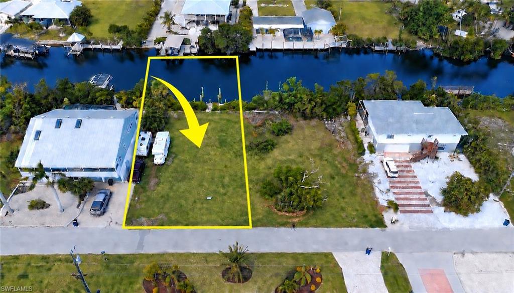 One of the last buildable lots in the sought after neighborhood of Serenity Cove in Bokeelia.  Come check out this 70' wide lot that is perfect for your dream home.  This lot already has a composite dock with post to tie up your boat.  With direct access to some of the best fishing and boating spots, including Sanibel, Cayo Costa, Captive, and Cabbage Key, you'll be just minutes away from exploring the beautiful waters without the hassle of navigating bridges.  
This location is also close to the Pine Island pool, pickleball and tennis courts, bike path, museums, marinas, and restaurants.  Don't miss this opportunity to own your piece of paradise!