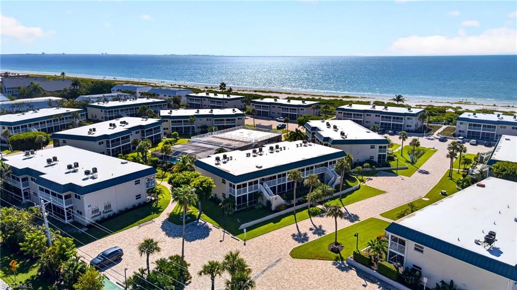 Welcome to your Sanibel island escape! This bright and inviting second-floor condo offers an easygoing coastal feel with plenty of space to settle into island time. Unit M7 features an open kitchen overlooking the spacious living and dining area, tile flooring throughout, a stacked washer and dryer, and convenient access from the second bedroom to the guest bath.
Two separate screened outdoor spaces add to the island lifestyle. The spacious front lanai offers a partial Gulf view and a breezy spot for morning coffee or an afternoon cocktail, while the primary bedroom opens directly to its own private screened balcony, creating a peaceful retreat at the end of a beach day. Impact windows and doors throughout the complex provide an added update, and Unit M7 came through the storm with no damage. Offered fully equipped and ready to enjoy, it can be your personal Sanibel getaway or return to rental use if desired.
Sanibel Arms West has long been a favorite of vacationers and owners, offering direct Gulf beach access, an on-site rental program, and an impressive collection of amenities. Spend your days shelling along the beach, relaxing by Sanibel's only screened and heated outdoor resort pool, soaking up the sunshine on the rooftop sundeck, or enjoying tennis, pickleball, grilling stations, a picnic area, clubroom with office, and boat dock.
Ideally located on Sanibel's East End, you're close to the Lighthouse, shops, restaurants, and bike paths, with the added convenience of easy access on and off the island. Beach days, bike rides, seashells, sunshine, and laid-back island living start right here.