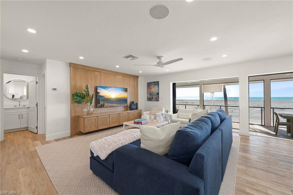 Offering a premier direct Gulf-front location, Beach Home 19 is an elevated 3 Bedroom + Den, 3 Bath residence positioned along one of Captiva’s most sought-after stretches of beach within the gates of South Seas. Thoughtfully redesigned and extensively renovated, this exceptional home blends modern coastal sophistication with the natural beauty of its beachfront setting. The open-concept interior features luxury vinyl flooring throughout, creating a seamless foundation for both durability and style. A custom floating staircase anchors the living space as a striking architectural focal point, enhancing light, volume, and visual flow. The beautifully appointed kitchen pairs form and function with custom wood cabinetry, substantial quartz countertops, premium stainless steel appliances, and a gas cooktop, true Gulf-front cooking with a view. Coastal-inspired furnishings and curated finishes create a relaxed yet refined atmosphere, allowing the Gulf to remain the focal point from nearly every room. Expansive impact-resistant windows invite abundant natural light while providing energy efficiency and peace of mind. Outdoor living is equally compelling, with composite decking designed for effortless enjoyment of sea breezes, sunsets, and direct access to the sugar-sand beach just steps away. Located within the gated South Seas community, Beach Home 19 offers privacy, exclusivity, and immediate access to some of the finest beaches in the United States. Whether envisioned as a private retreat or a luxury investment opportunity, this residence captures the essence of Gulf-front living on Captiva Island.