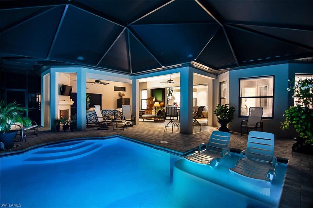 Built in 2017, this 2100 sq ft Farnese Plan crafted by Taylor Morrison is priced under $500,000. Well- appointed outdoor space compliments the fully upgraded interior, including multiple trey ceilings, hurricane impact windows/doors, Saratoga style leaded glass door, architectural arches & drywall rounded corners, upscale guest bath, extra crown mold & 8’ doors. 18” diagonal tile, upgraded carpet, & engineered wood flooring. The gourmet kitchen has level 5 quartz countertops, large island, 42” Shaker cabinets, & GE Café stainless appliances including gas cooktop. Master bath boasts quartz counters & a frameless walk-in shower. Extended screened alcove/lanai with picture frame screen invites you & your guests to soak in the quiet, private back yard that backs up to a picturesque landscaped area. Cool off in the salt water gas heated pool with Sun shelf & sheer descent water feature. Gas fireplace, soft colored pavers, roll down privacy shades, “Sonos” audio system, and plumbed for outdoor kitchen add the finishing touches to this fabulous outdoor living space. The 90 unit Pebble Pointe community is strategically situated near Coconut Point Mall, Miramar Outlets, I-75 & RSW Airport.