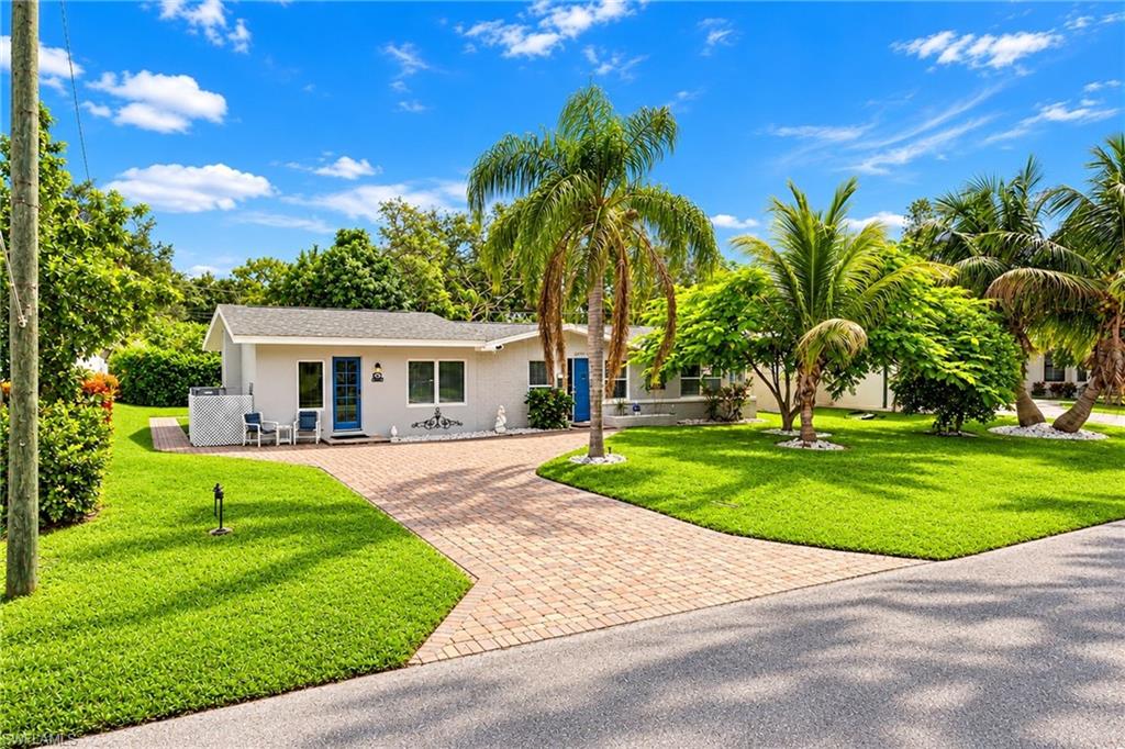 Welcome to Sunset Acres! Enjoy a fantastic location west of US-41, just a bike ride or short drive from Bonita Beach and Barefoot Beach. This charming 3-bedroom, 2-bathroom home is being offered turnkey and move in ready, making it easy to start enjoying the Florida lifestyle right way! The house was freshly painted in 2024. In 2022, a new addition was added, creating a spacious primary bedroom with its own exterior door. 
Driveway and back patio pavers have been sealed (2023). Main bathroom features a newer toilet, sink, and vanity.
Tankless water heater installed in 2022. Newer split A/C systems in two bedrooms installed in 2024.
 Step outside to a spacious yard with a patio, the perfect spot to relax and unwind after a day at the beach. Whether you're looking for a full time residence, a vacation getaway, or an investment property, this home offers wonderful possibilities in a highly desirable location. 
Enjoy the convenience of nearby restaurants, many within walking distance, along with easy access to shopping, grocery stores, Riverside Park, the dog park, Wonder Gardens, Bonita Springs Performing Arts Center, easy access to I-75 and much more. Don't miss this opportunity to enjoy the best of Southwest Florida living.